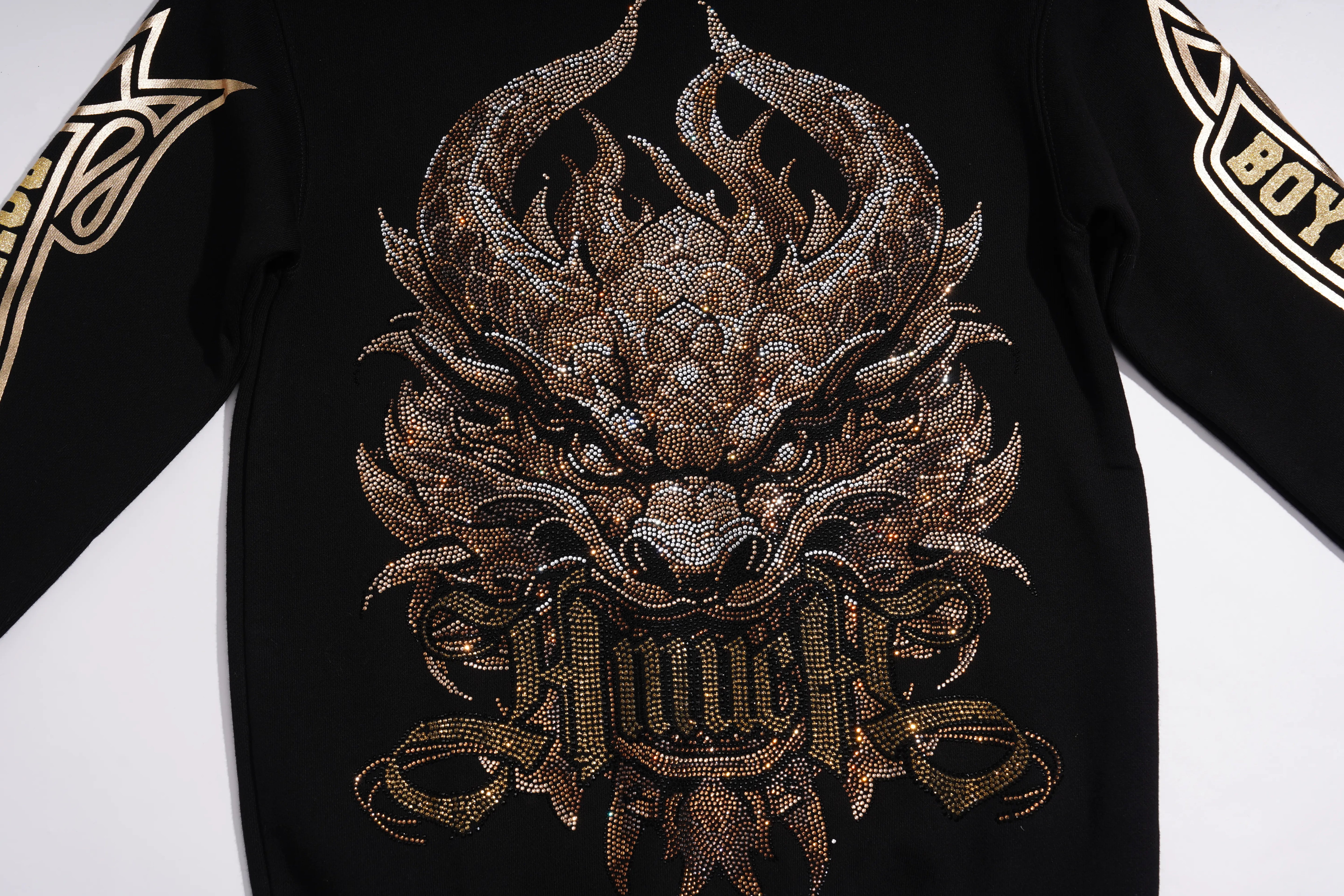 Black long-sleeve sweatshirt featuring a large, highly detailed metallic gold dragon head graphic on the front, with gold lettering on the sleeves. TCH Luxury Gold Dragon Rhinestone Graphic Black Sweatshirt