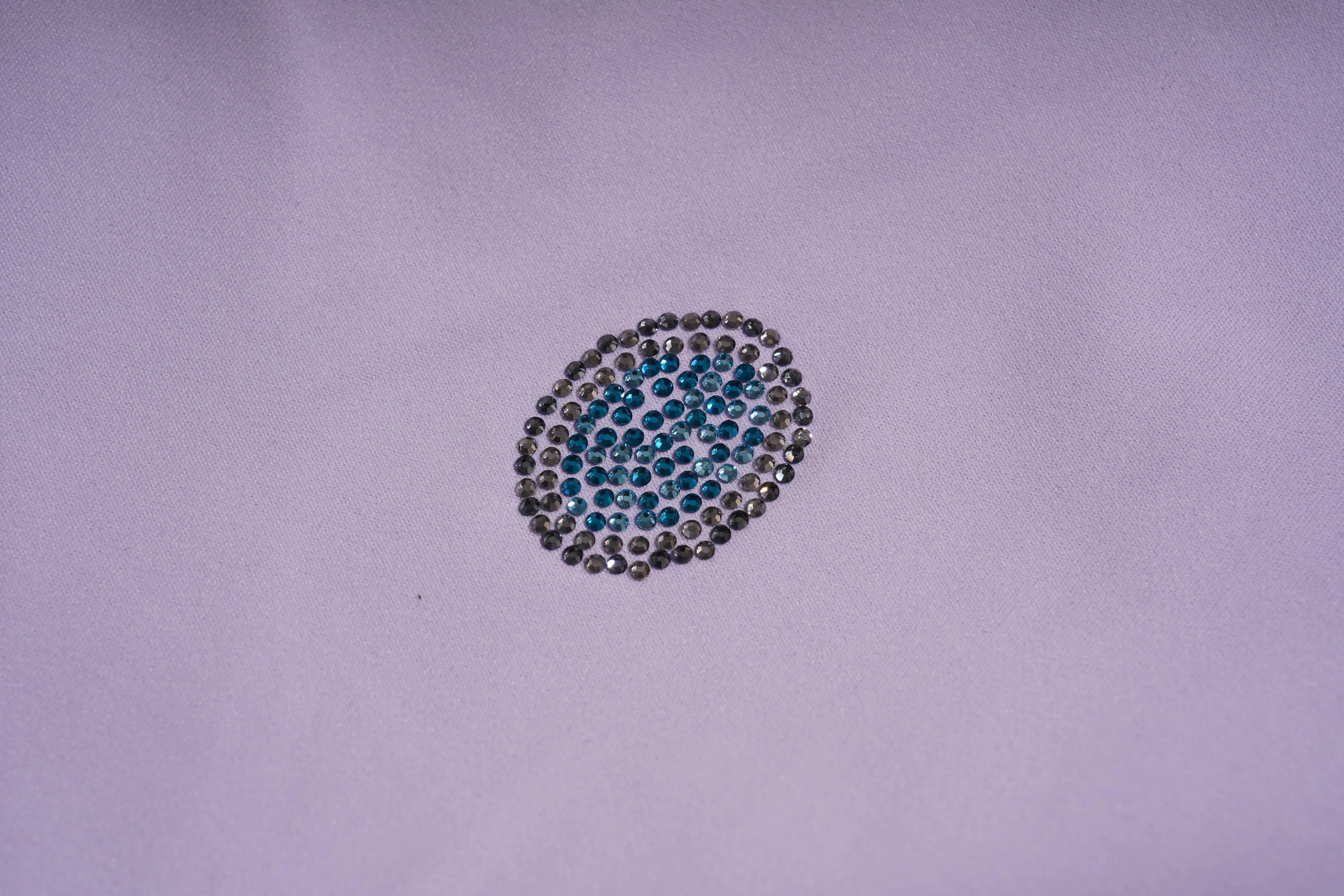 Circular pattern of blue and silver rhinestones on a light purple background, TCH Moonlight Rhinestone Wide-Leg Pants