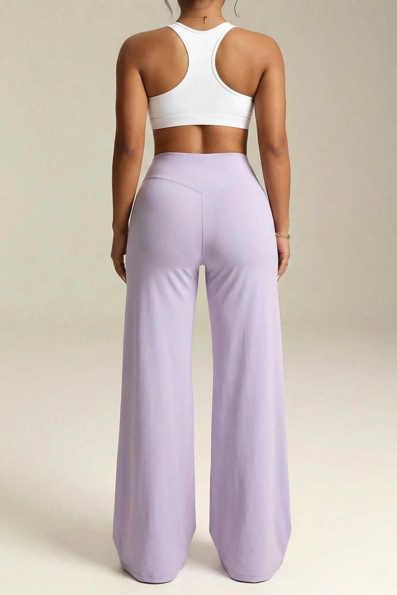 Person wearing a white sports bra and lavender leggings on a neutral background, TCH Moonlight Rhinestone Wide-Leg Pants