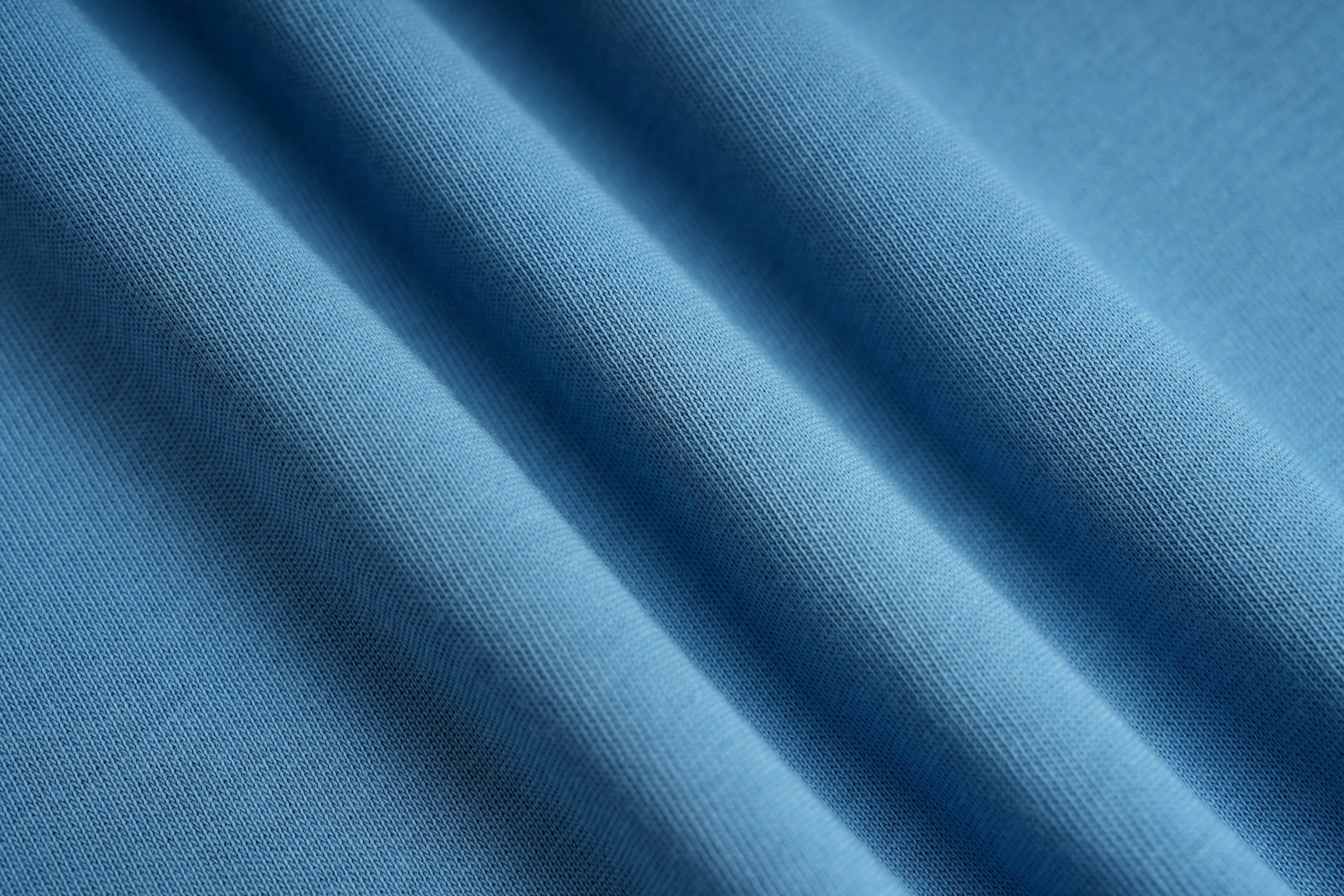 Close-up of blue fabric with folds, TCH My Baby Rhinestone Bear Oversized Blue T-Shirt