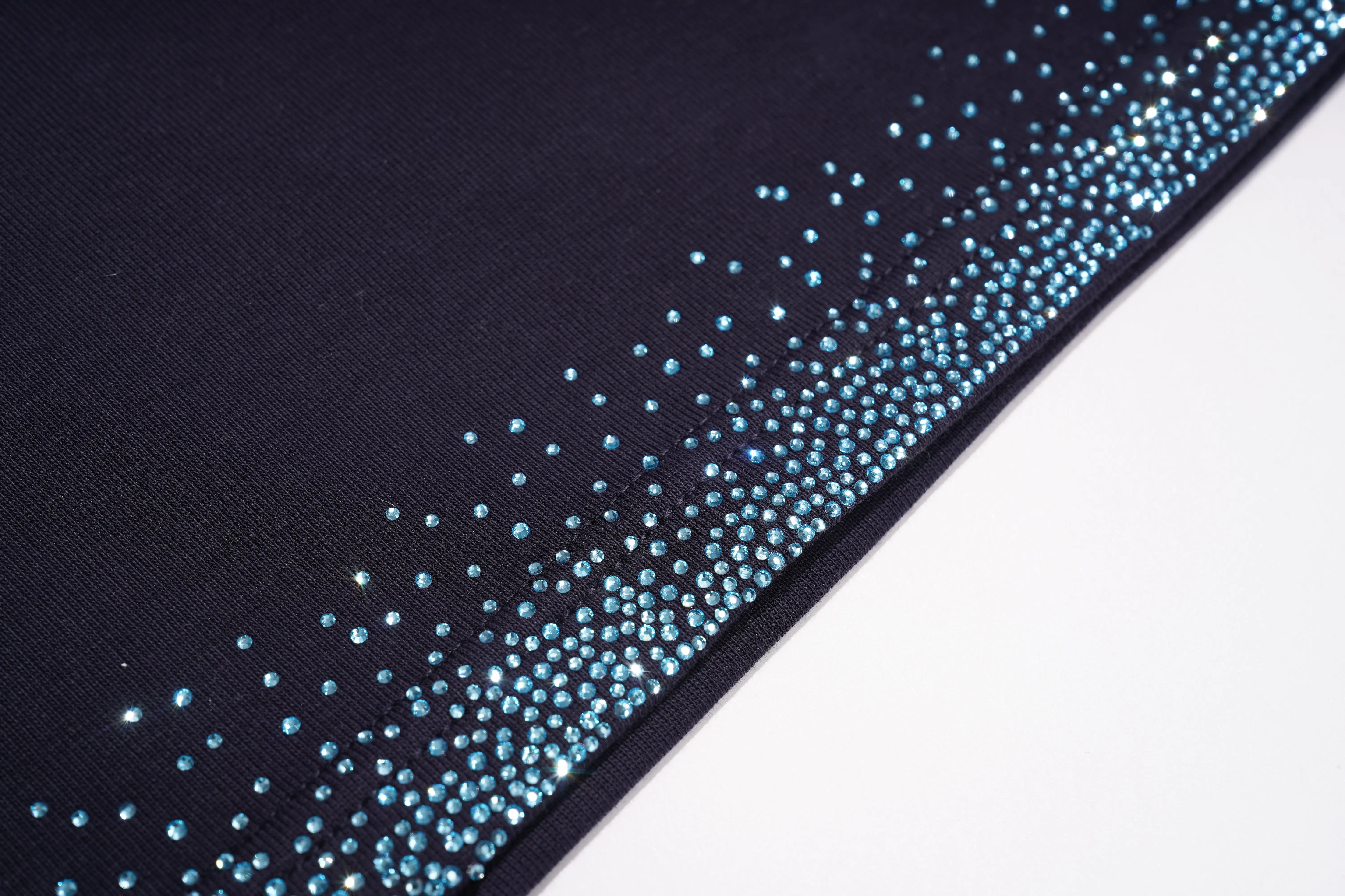 Close-up of a black fabric with blue rhinestone border on a white background, TCH Navy Sailor Bow Wings Rhinestone Two-Piece Set