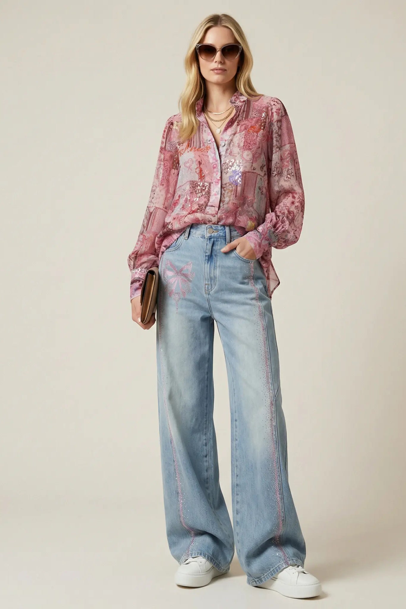 Woman wearing a pink floral blouse and blue jeans against a plain background, TCH Pink Patchwork Rhinestone Floral Shirt