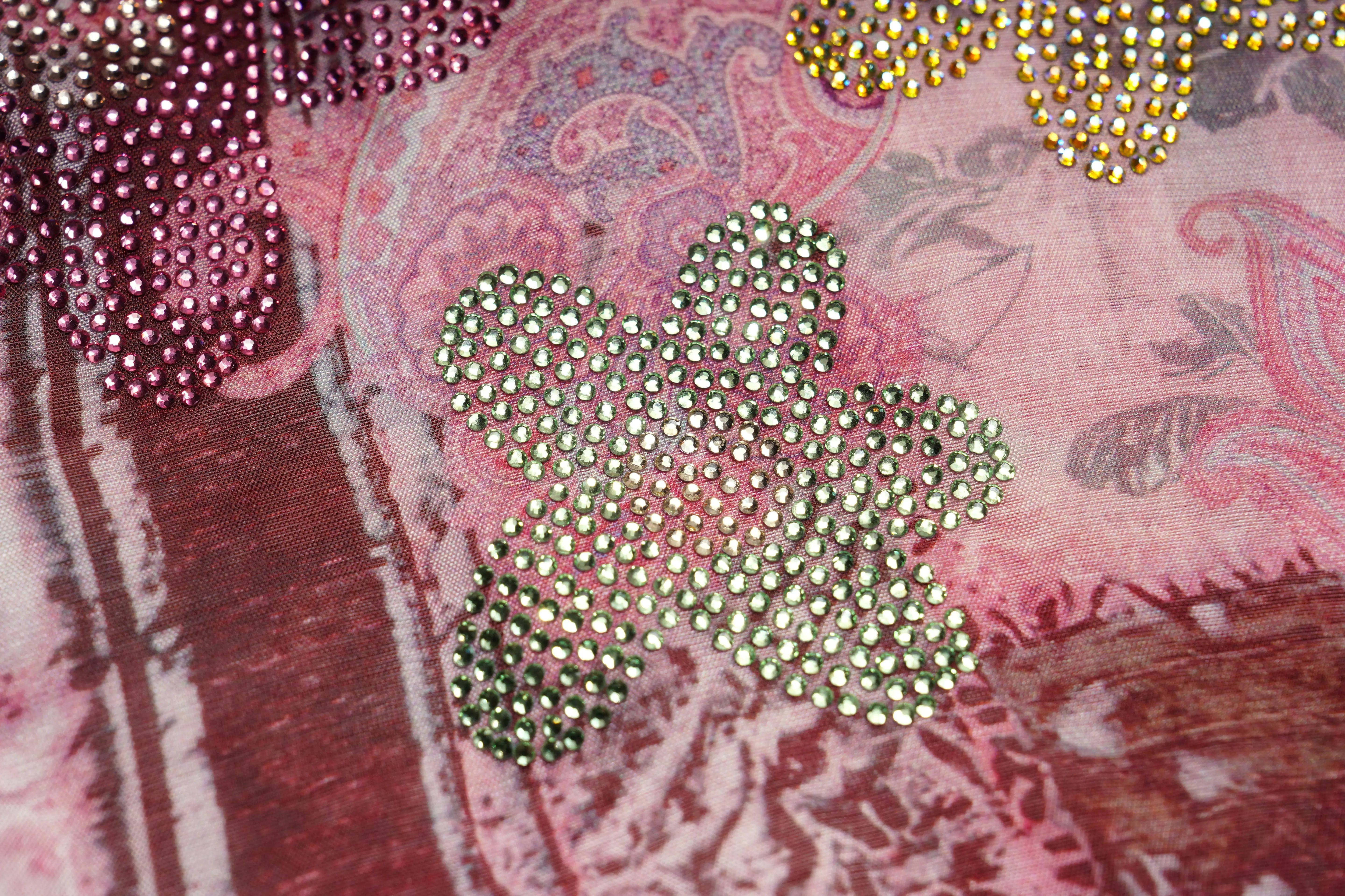 Close-up of decorative brooches with intricate patterns on a textured fabric background, TCH Pink Patchwork Rhinestone Floral Shirt