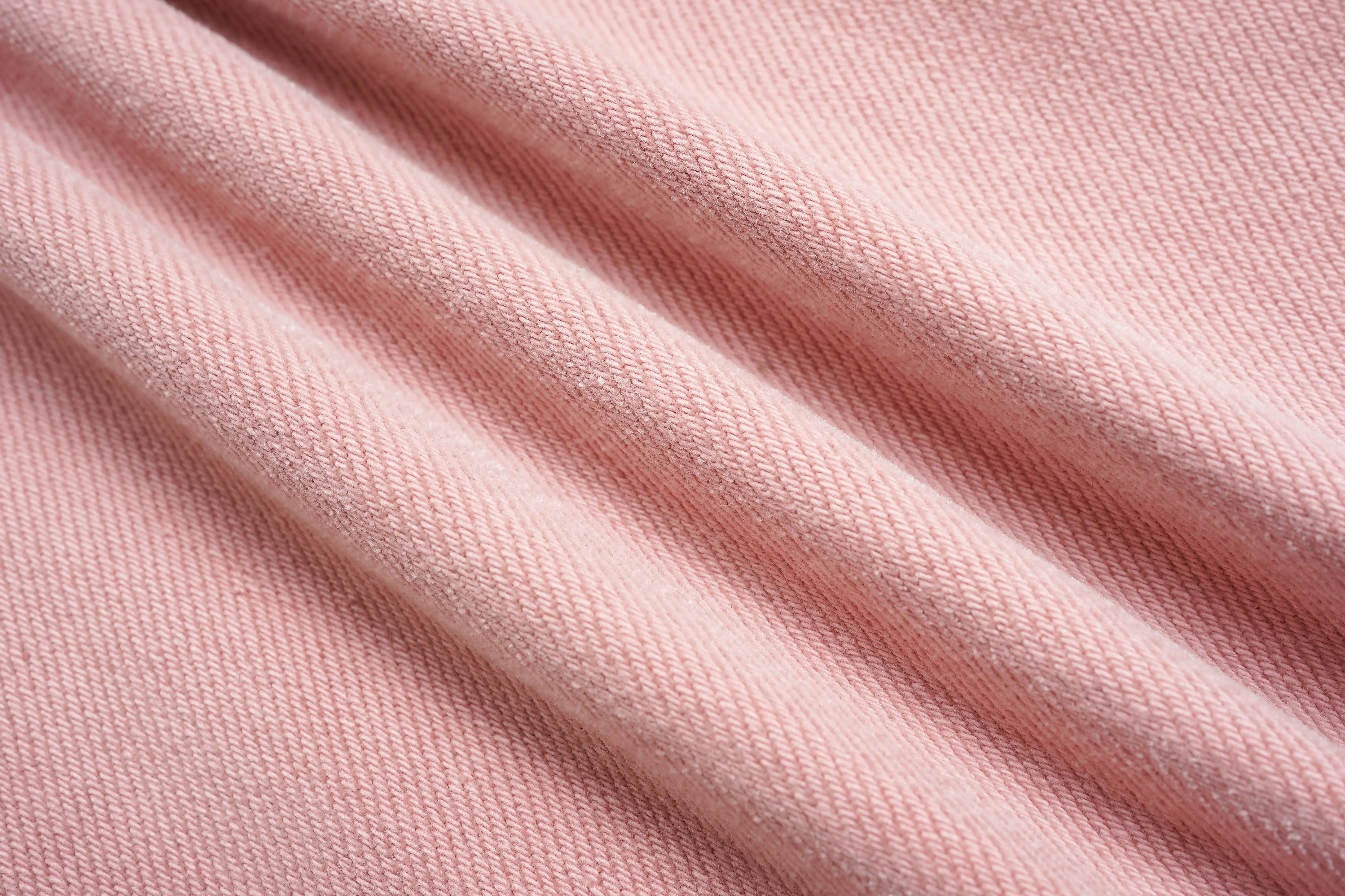 Close-up of pink fabric with visible texture, TCH Pink Rhinestone Bear & Floral Wide-Leg Pants