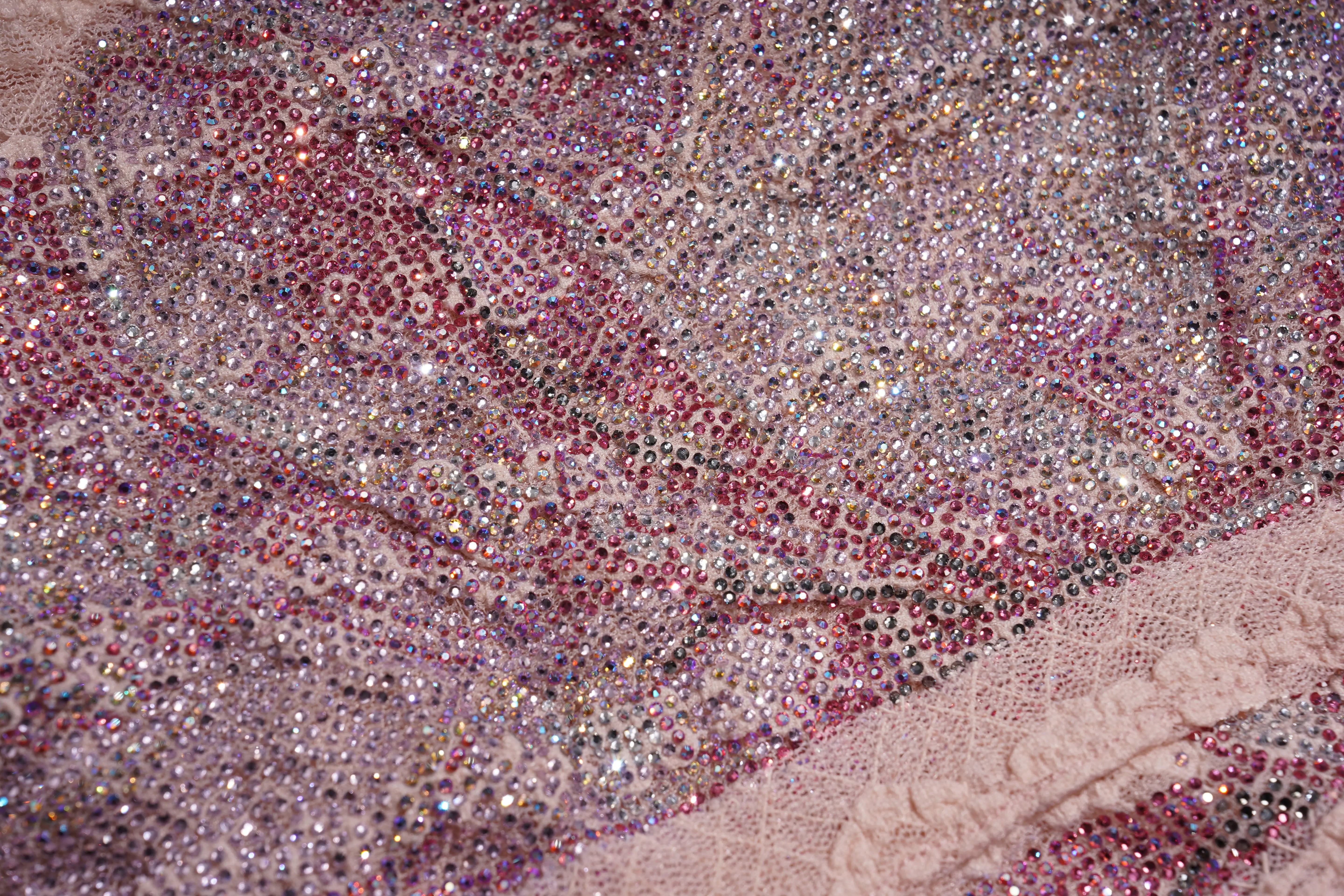 Close-up of a fabric with colorful rhinestone embellishments, TCH Pink Rhinestone Bow Lace Layered Dress