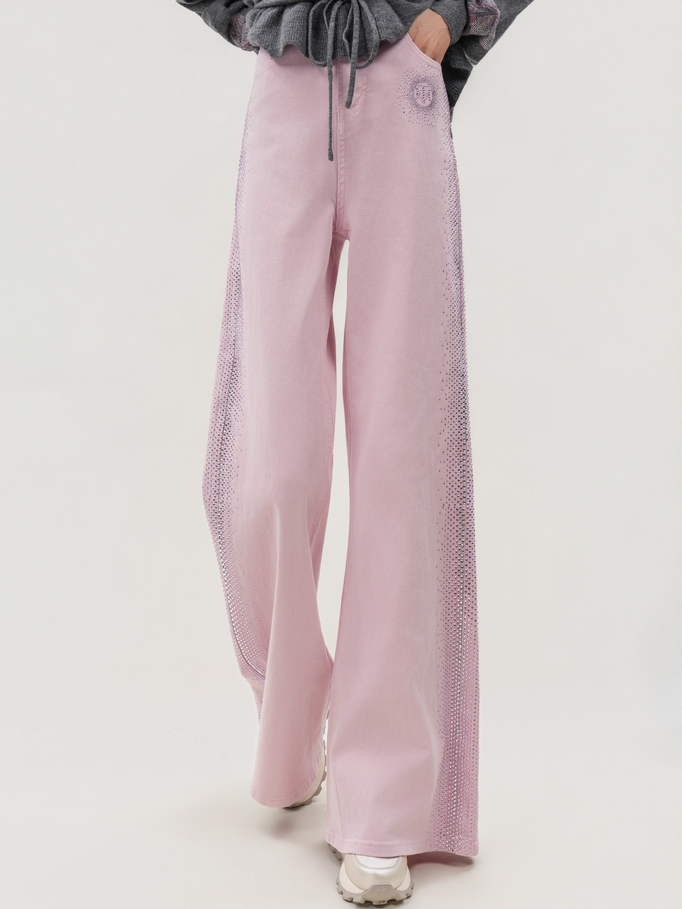 Pink wide-leg pants worn by a person on a light gray background, TCH Pink Rhinestone Gradient Denim Jeans with Logo Detail