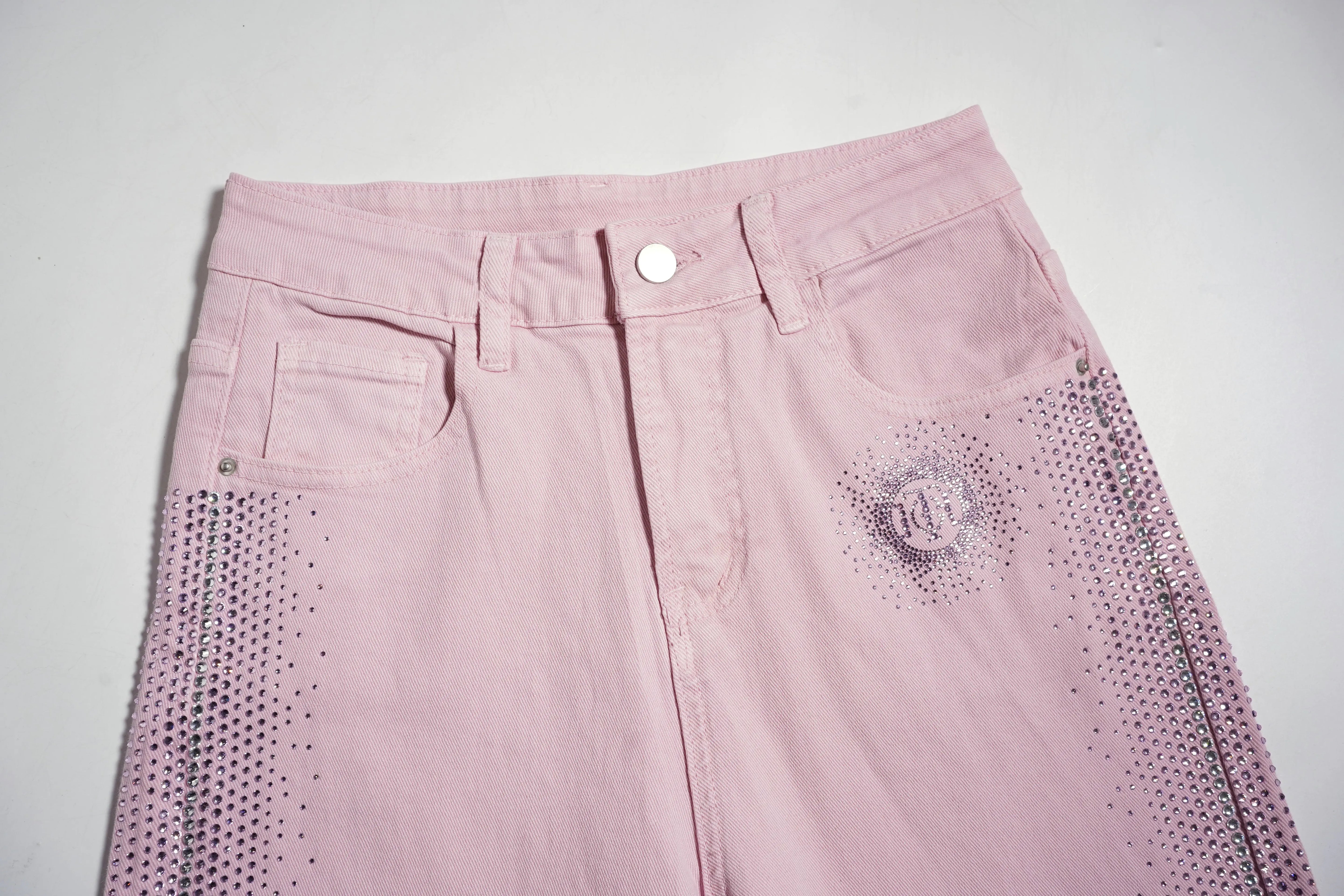 Pink pants with decorative elements on a light gray background, TCH Pink Rhinestone Gradient Denim Jeans with Logo Detail