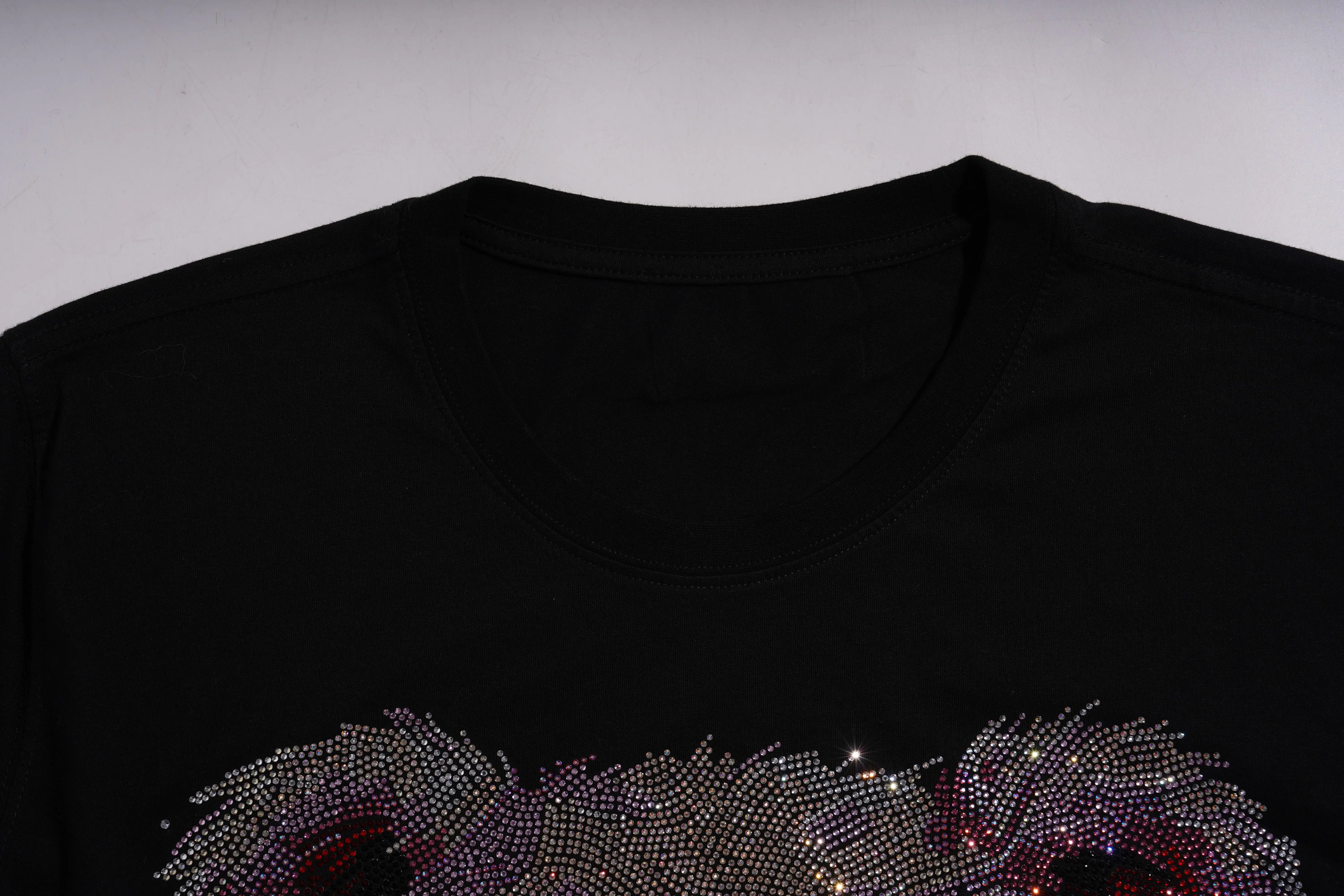 Black t-shirt with a decorative floral pattern made of rhinestones on a plain background, TCH Pink Teddy Bear Rhinestone T-Shirt
