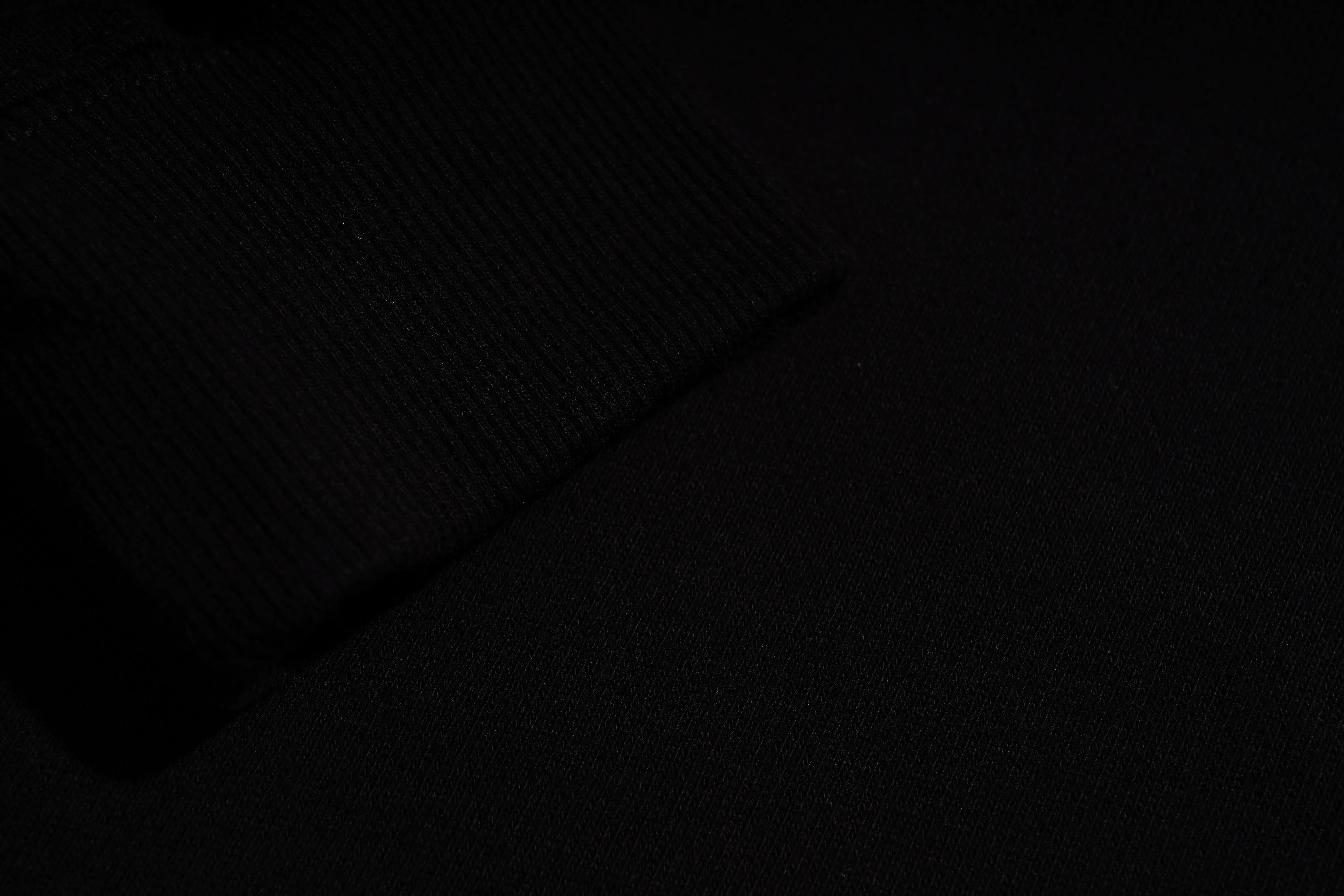 Black textured fabric with a subtle pattern, TCH Pink Teddy Rhinestone Sweatshirt