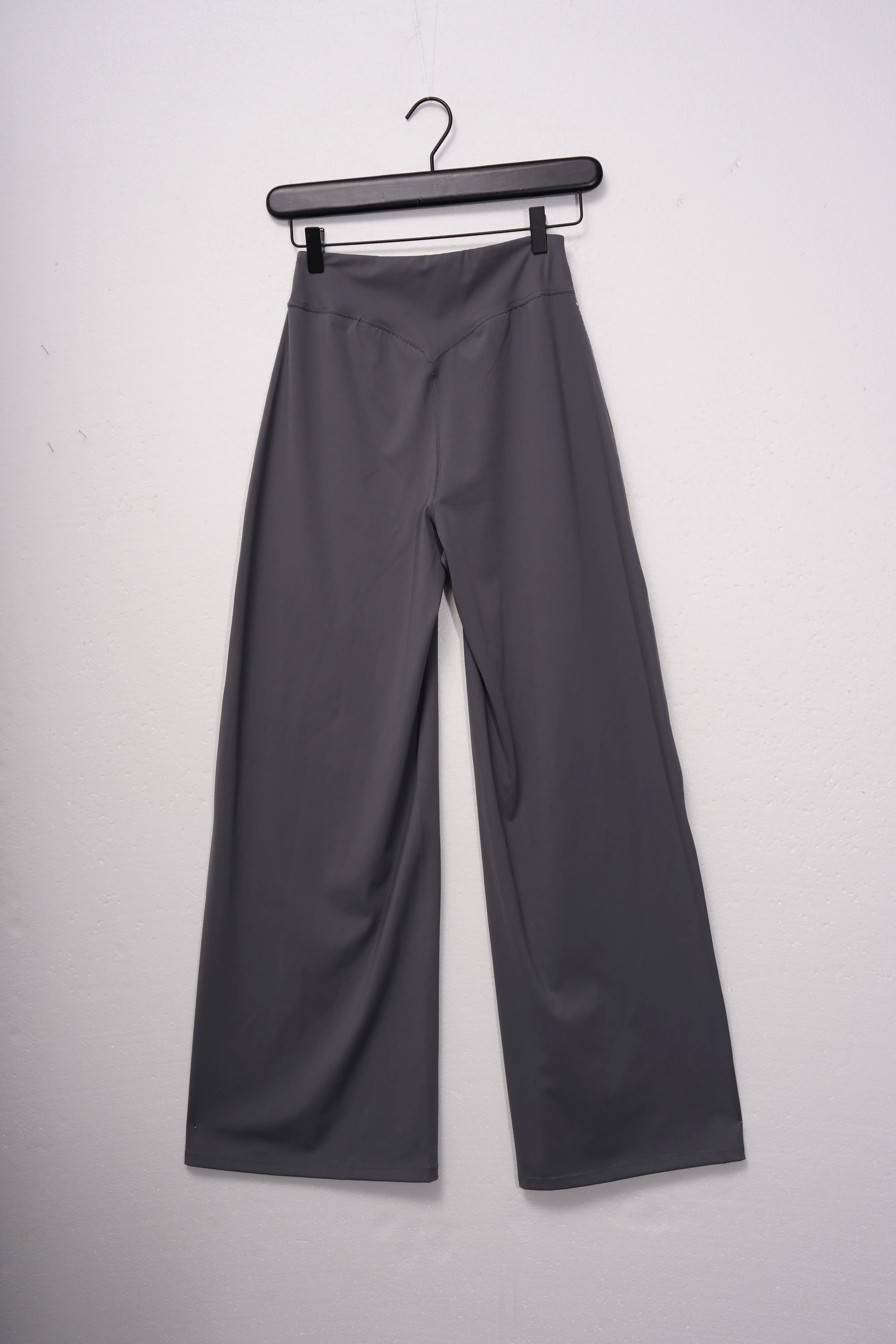 Gray pants on a hanger against a white background, TCH Purple Rhinestone Gradient Sweatpants
