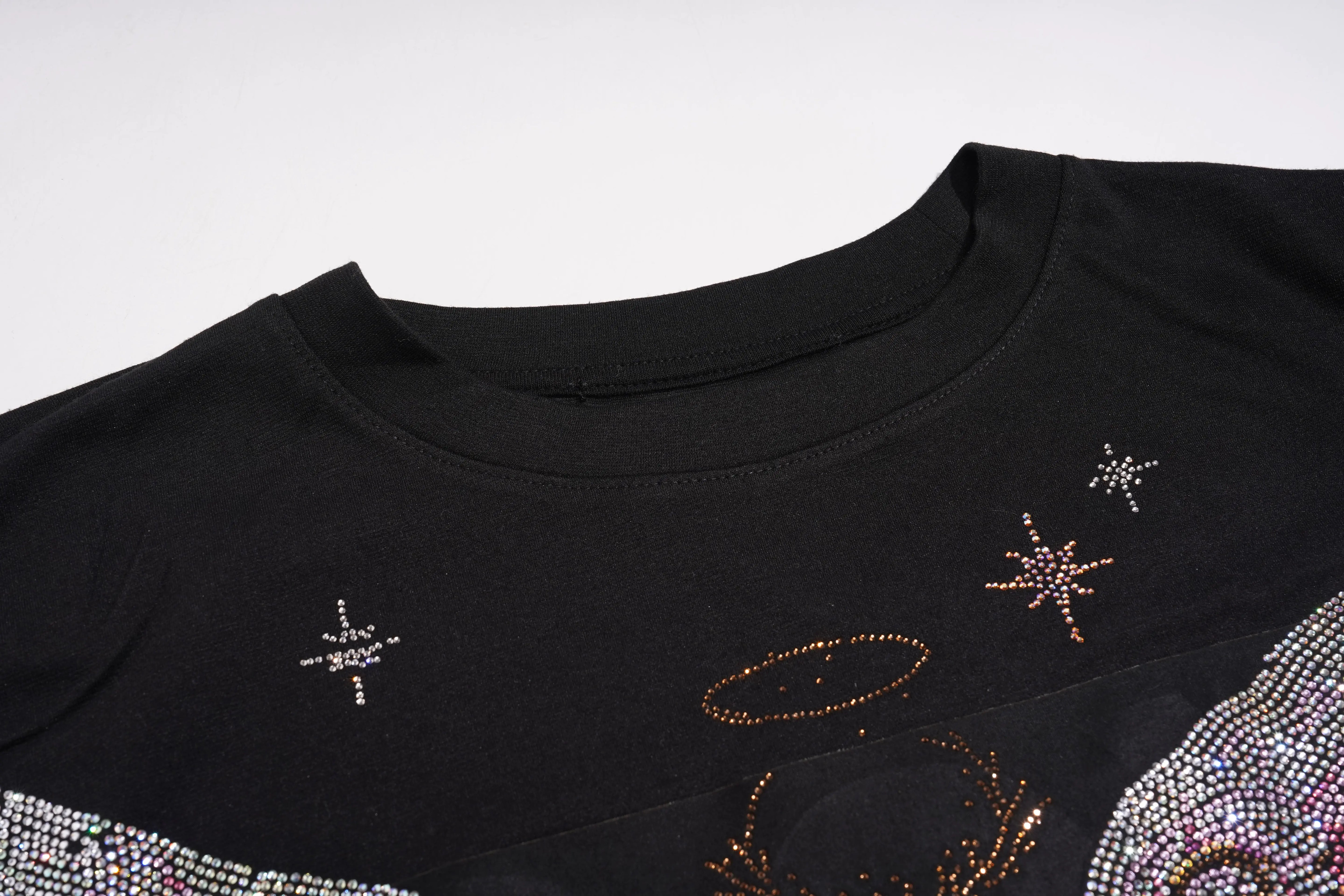 Black top with star and moon designs made of rhinestones on a white background, TCH Rhinestone Angel Wing Black Dress