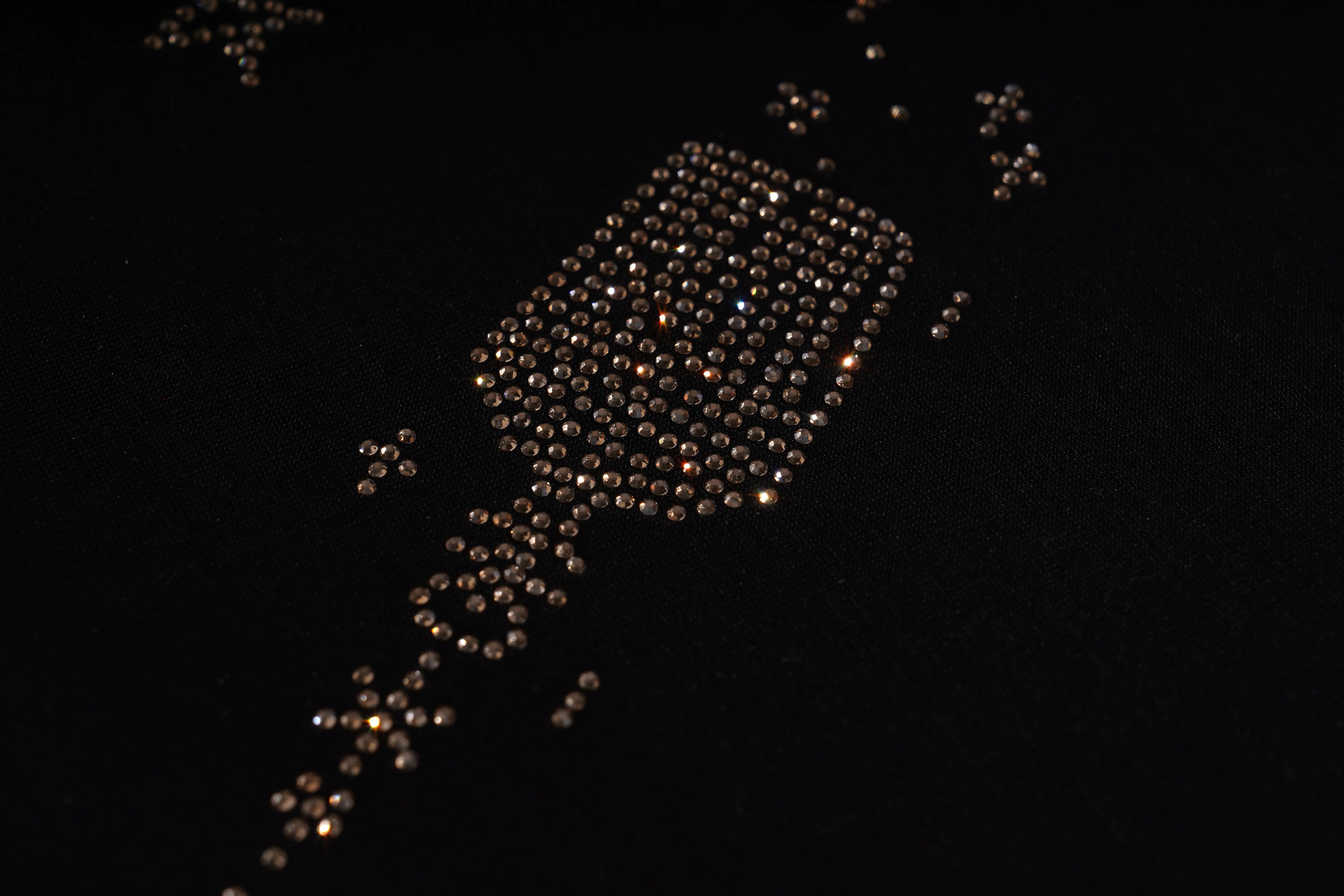 Decorative arrangement of small lights shaped like a bottle on a black background, TCH Rhinestone Angel Wing Black Dress