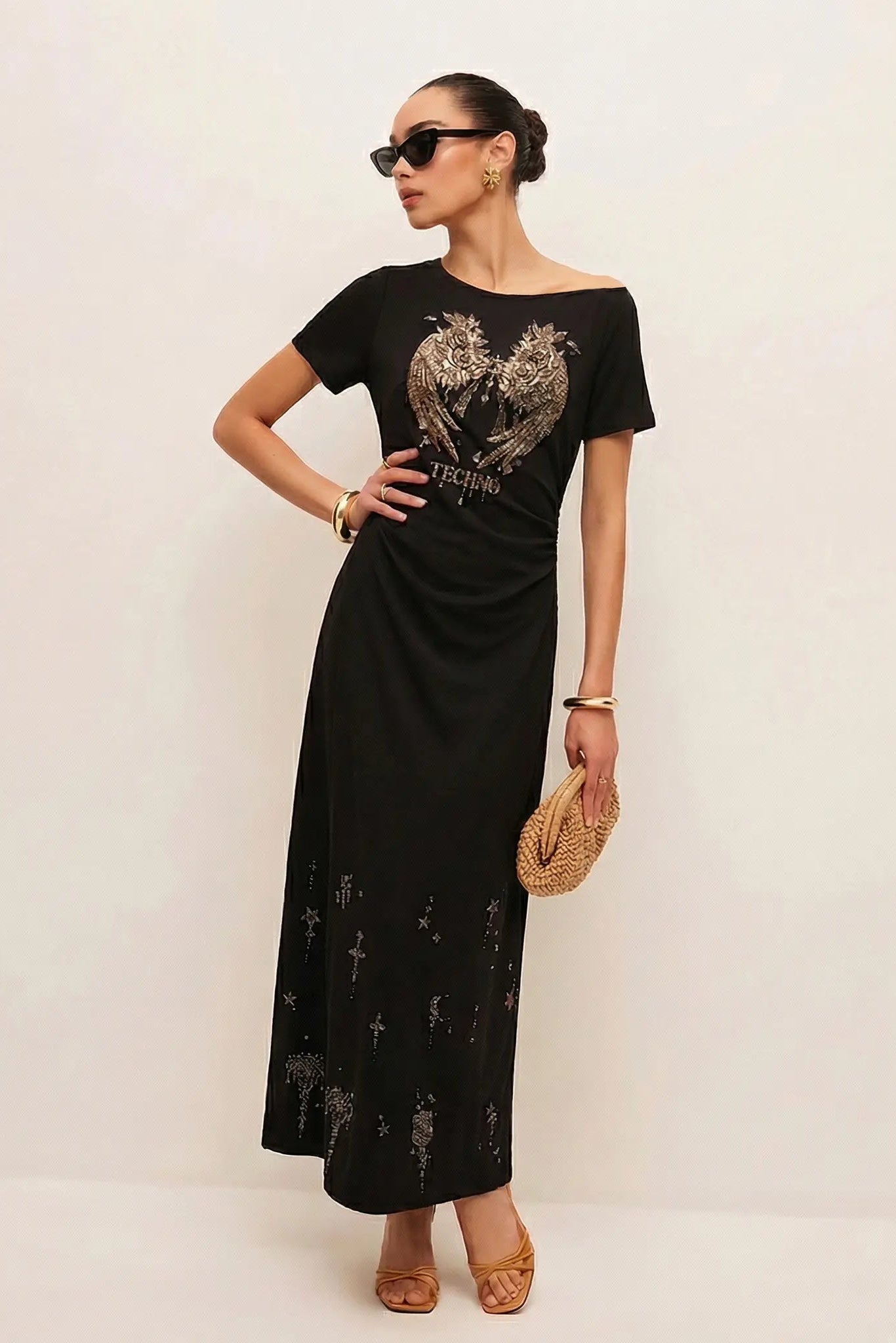 Woman wearing a black dress with a graphic design on a plain background, TCH Rhinestone Angel Wing Black Dress