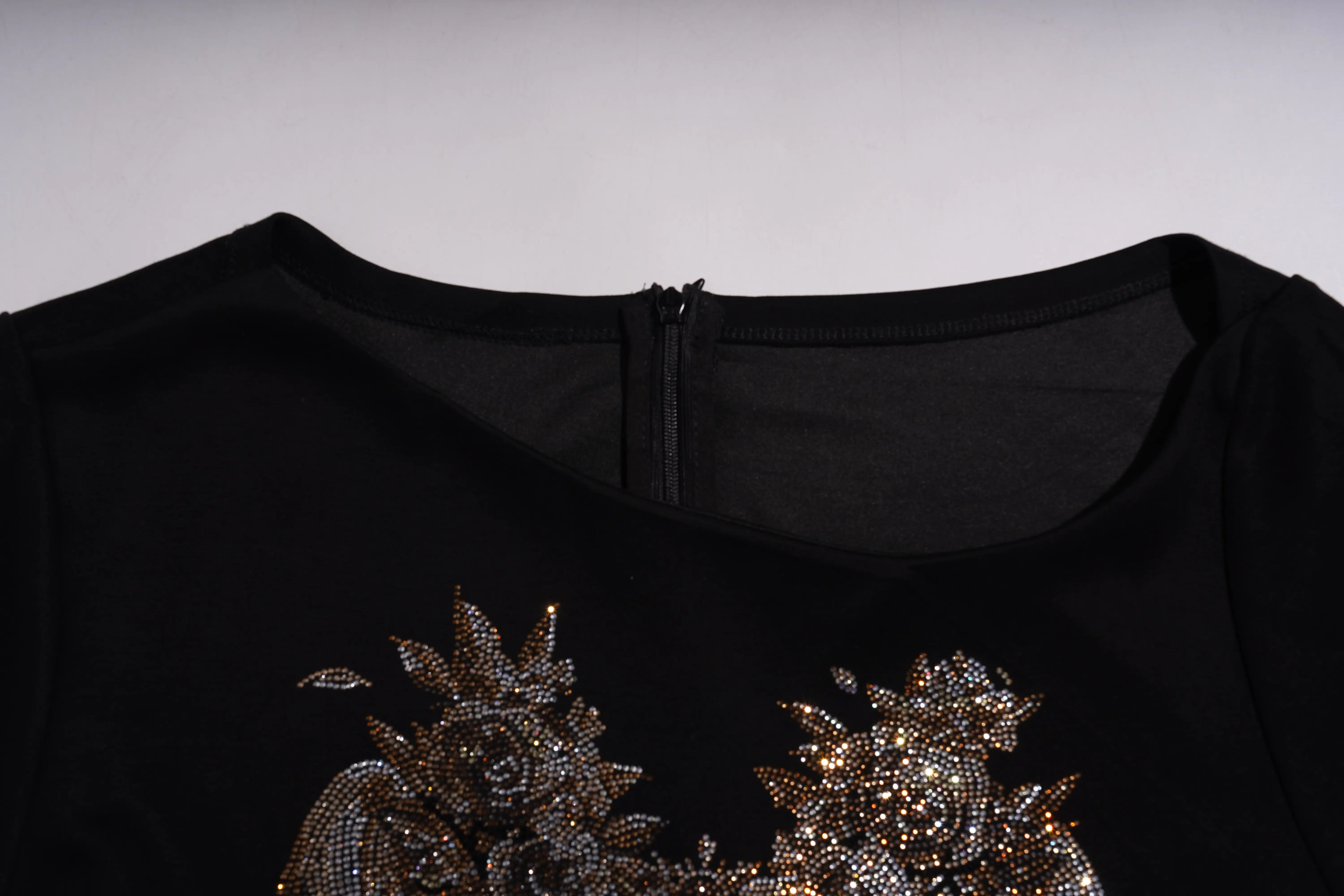 Black garment with intricate gold embroidery on a plain background, TCH Rhinestone Angel Wing Black Dress