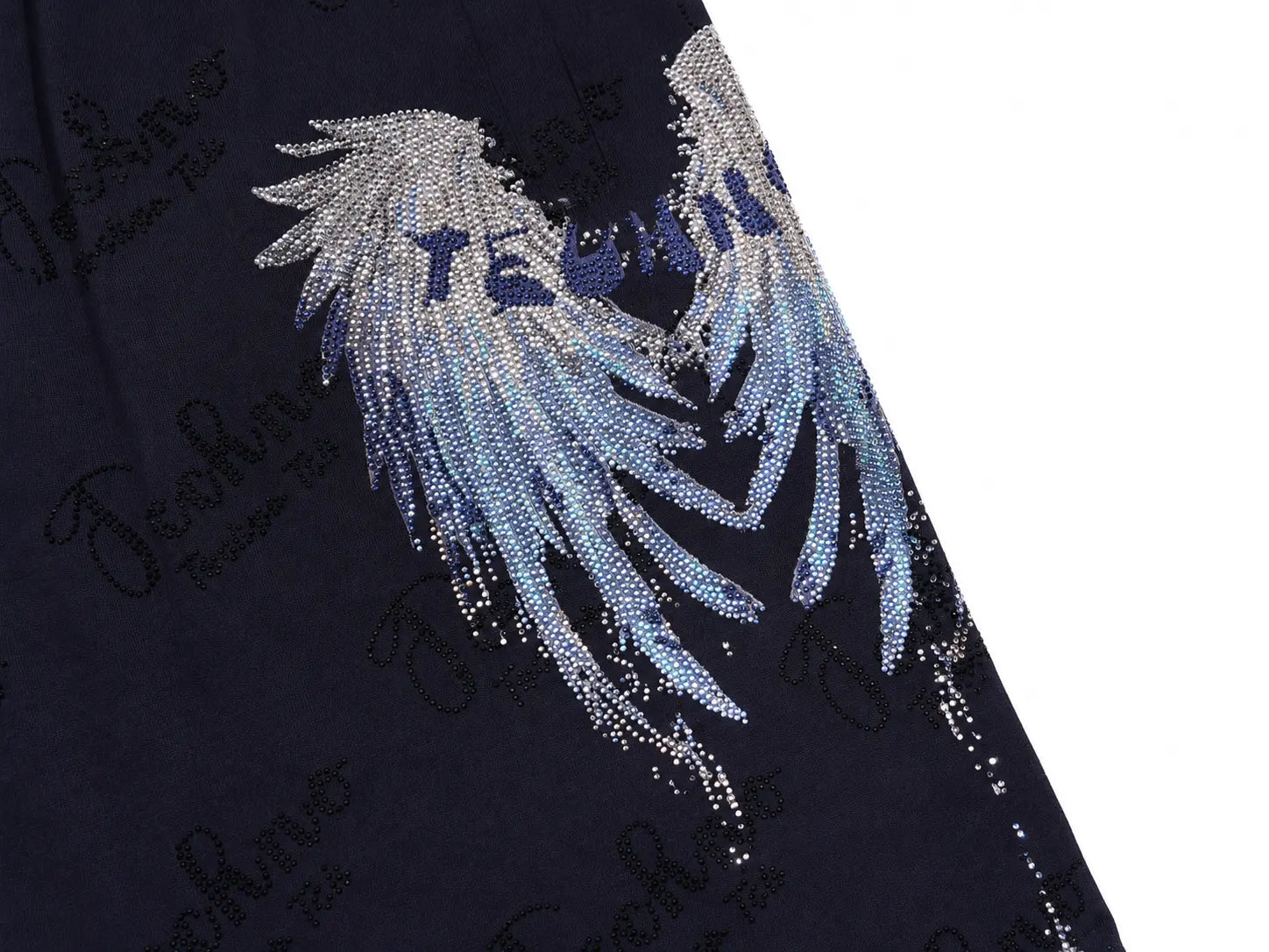 Close-up of a dark navy garment featuring a large rhinestone-embellished angel wing graphic with the word 'TECHNO' in blue lettering, on a white background. TCH Rhinestone Angel Wing Gradient Cargo Shorts