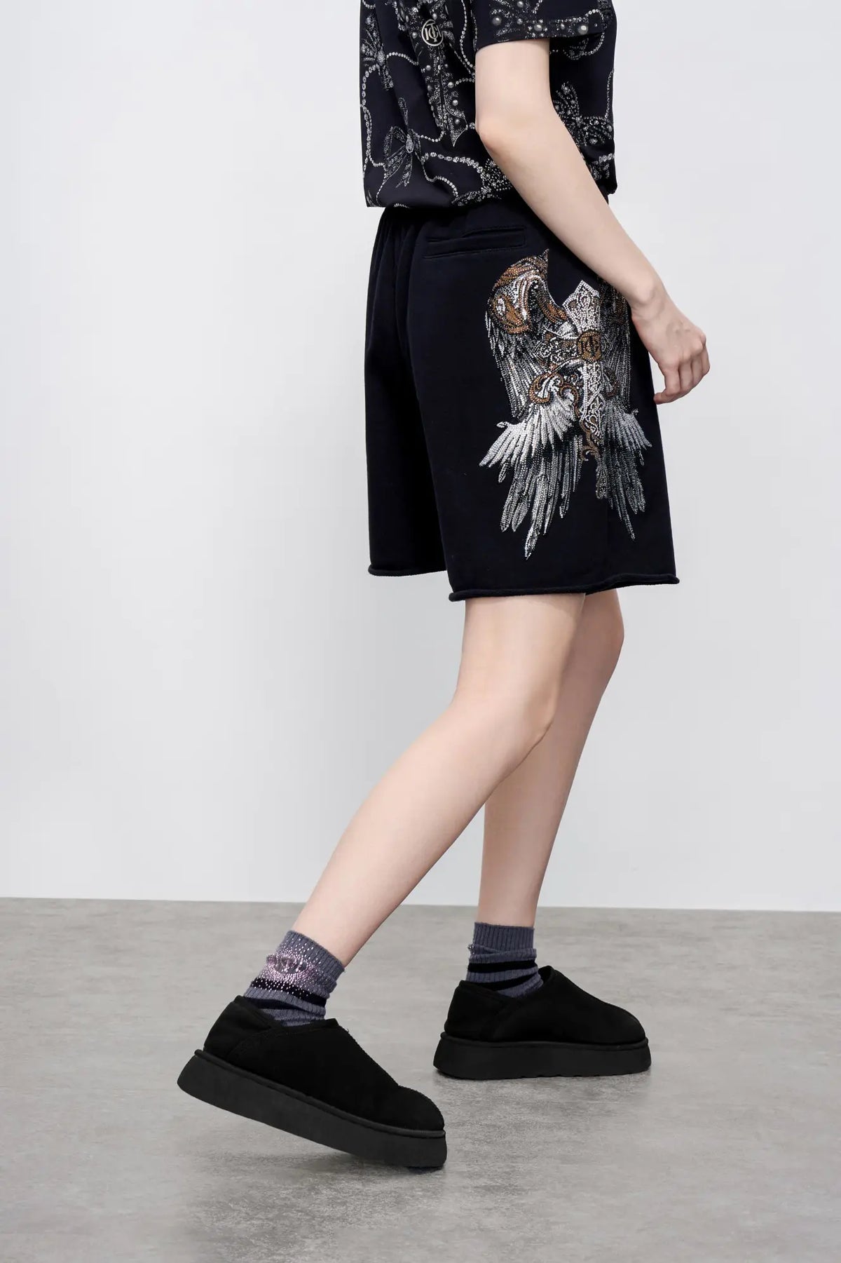 TCH Rhinestone Angel Wings Black Sweat Shorts TCH angel wings shorts Rhinestone black sweat shorts Black graphic shorts Angel wing sweat shorts Embellished black shorts Rhinestone streetwear shorts Y2K black shorts Relaxed fit sweat shorts Gothic graphic shorts Black casual drawstring shorts