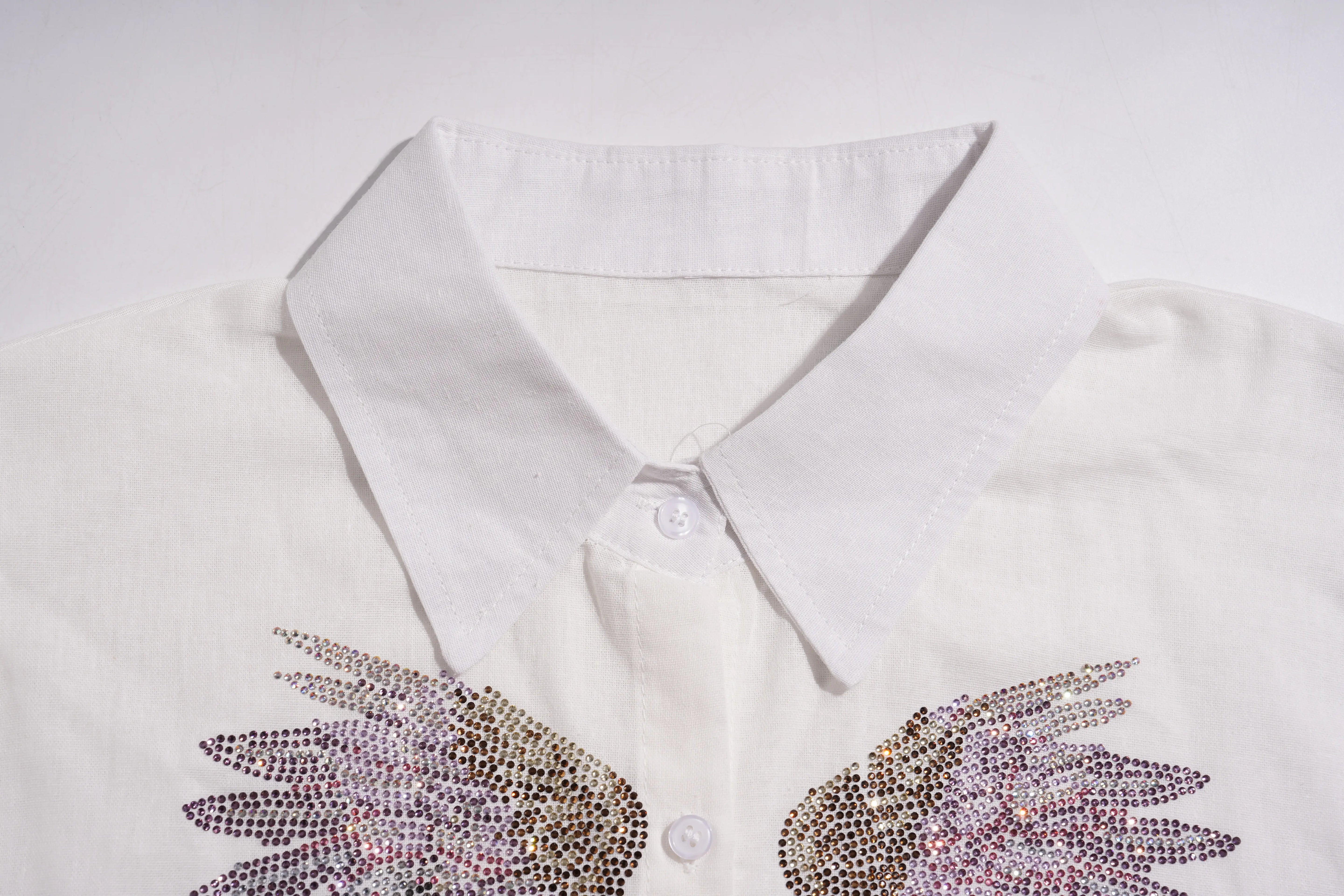 White shirt with rhinestone wings on a white background, TCH Rhinestone Angel Wings & Cross Set