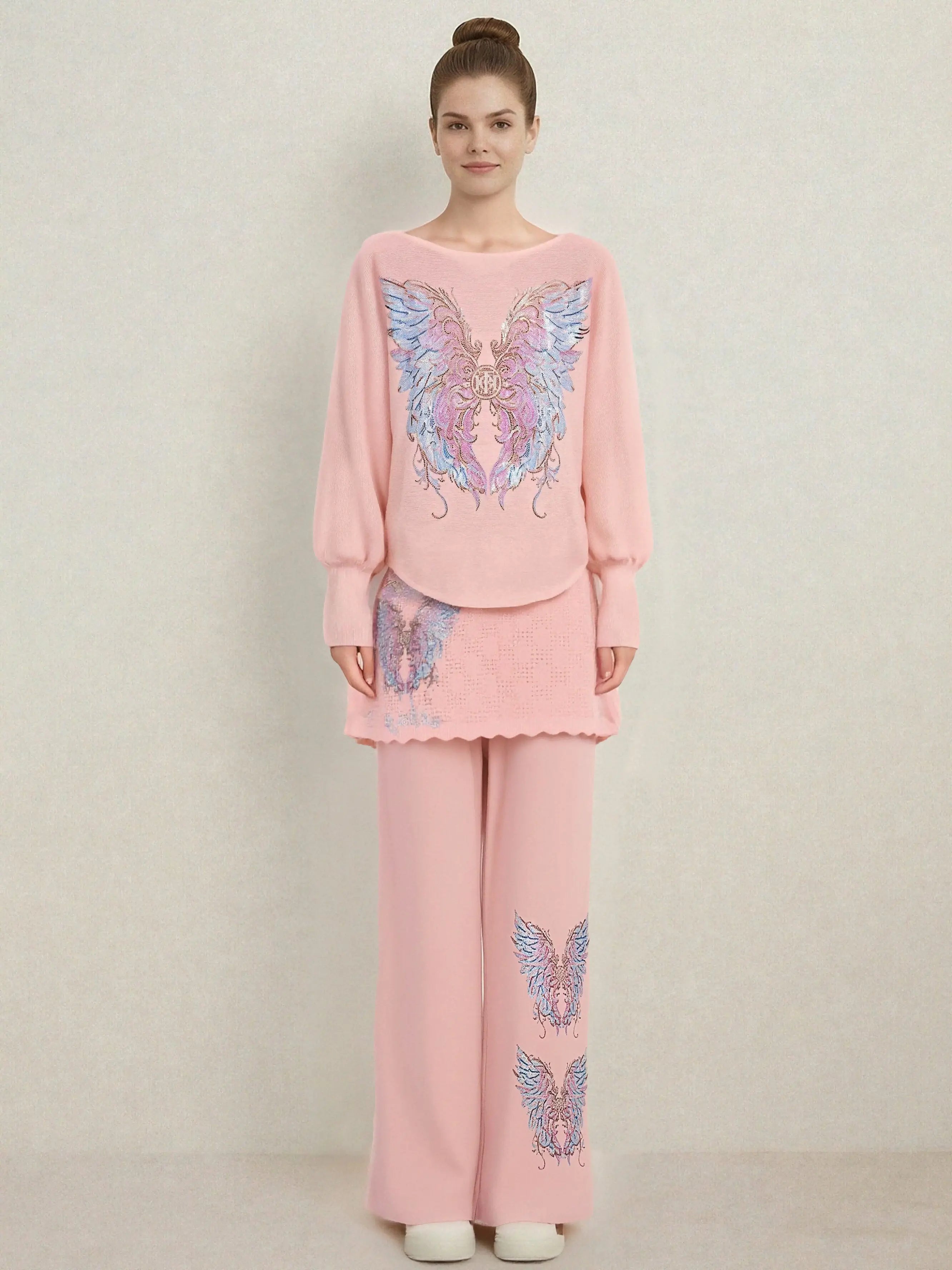 Woman wearing a pink outfit with butterfly designs on a plain background, TCH Rhinestone Angel Wings Layered Knit Top & Wide-Leg Pants Set