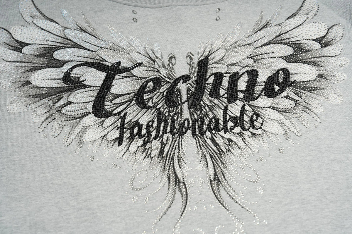 TCH Rhinestone Angel Wings Oversized Grey Sweatshirt TCH angel wings sweatshirt Grey rhinestone sweatshirt Oversized grey sweatshirt Angel wing graphic pullover Rhinestone embellished sweatshirt Black and white graphic sweatshirt Oversized streetwear sweatshirt Feather wing graphic top Y2K graphic sweatshirt Grey casual crewneck sweatshirt