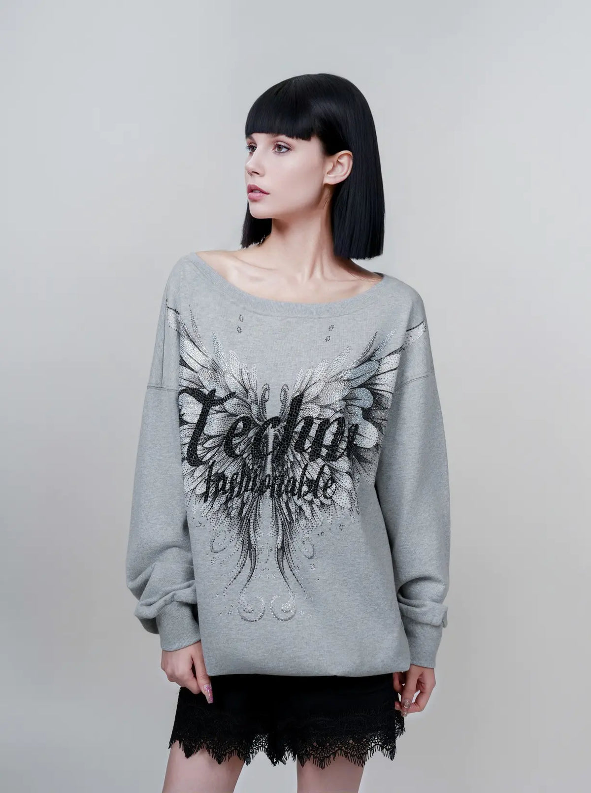 TCH Rhinestone Angel Wings Oversized Grey Sweatshirt TCH angel wings sweatshirt Grey rhinestone sweatshirt Oversized grey sweatshirt Angel wing graphic pullover Rhinestone embellished sweatshirt Black and white graphic sweatshirt Oversized streetwear sweatshirt Feather wing graphic top Y2K graphic sweatshirt Grey casual crewneck sweatshirt