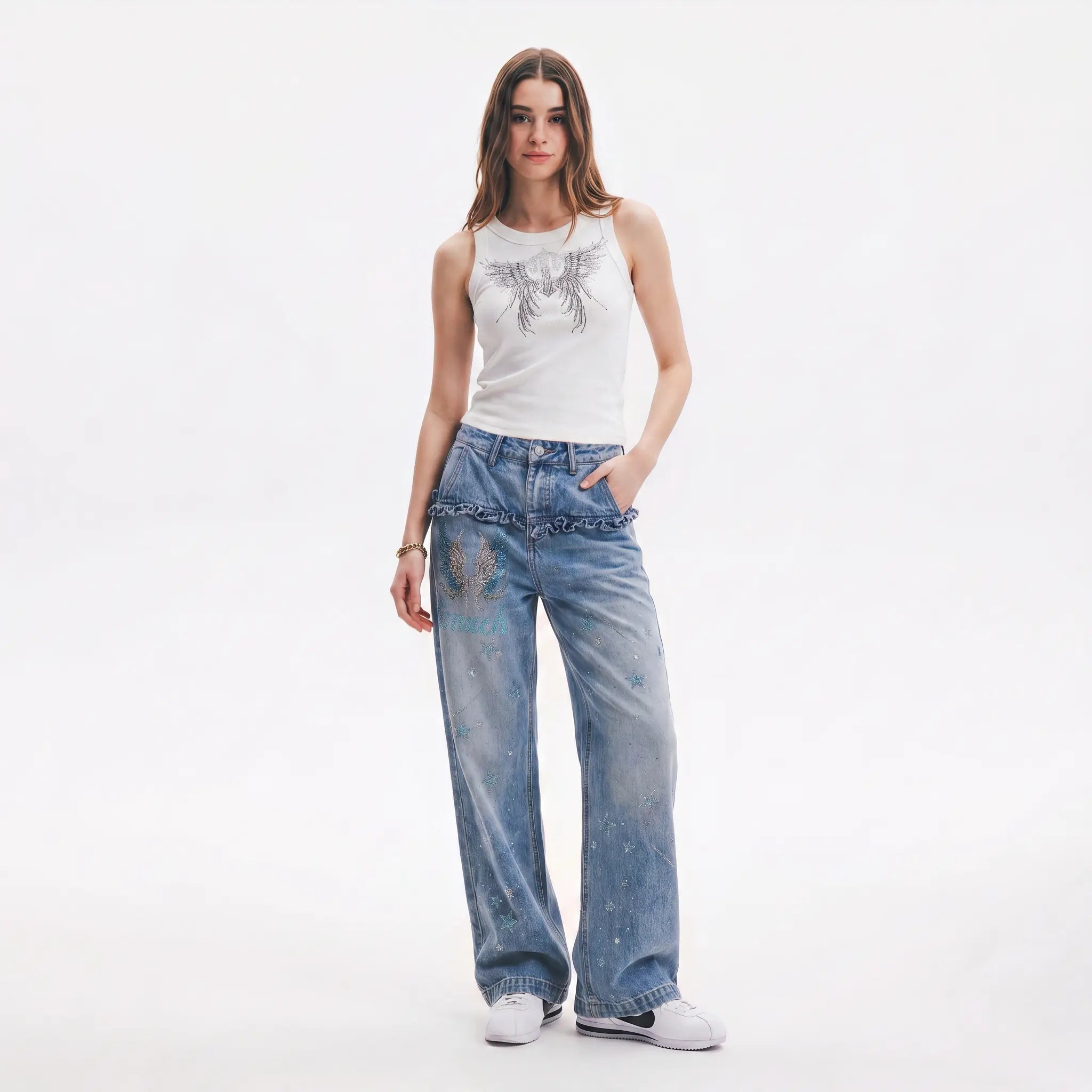 Woman wearing a white tank top and blue jeans on a white background, TCH Rhinestone Angel Wings Ribbed Tank Top