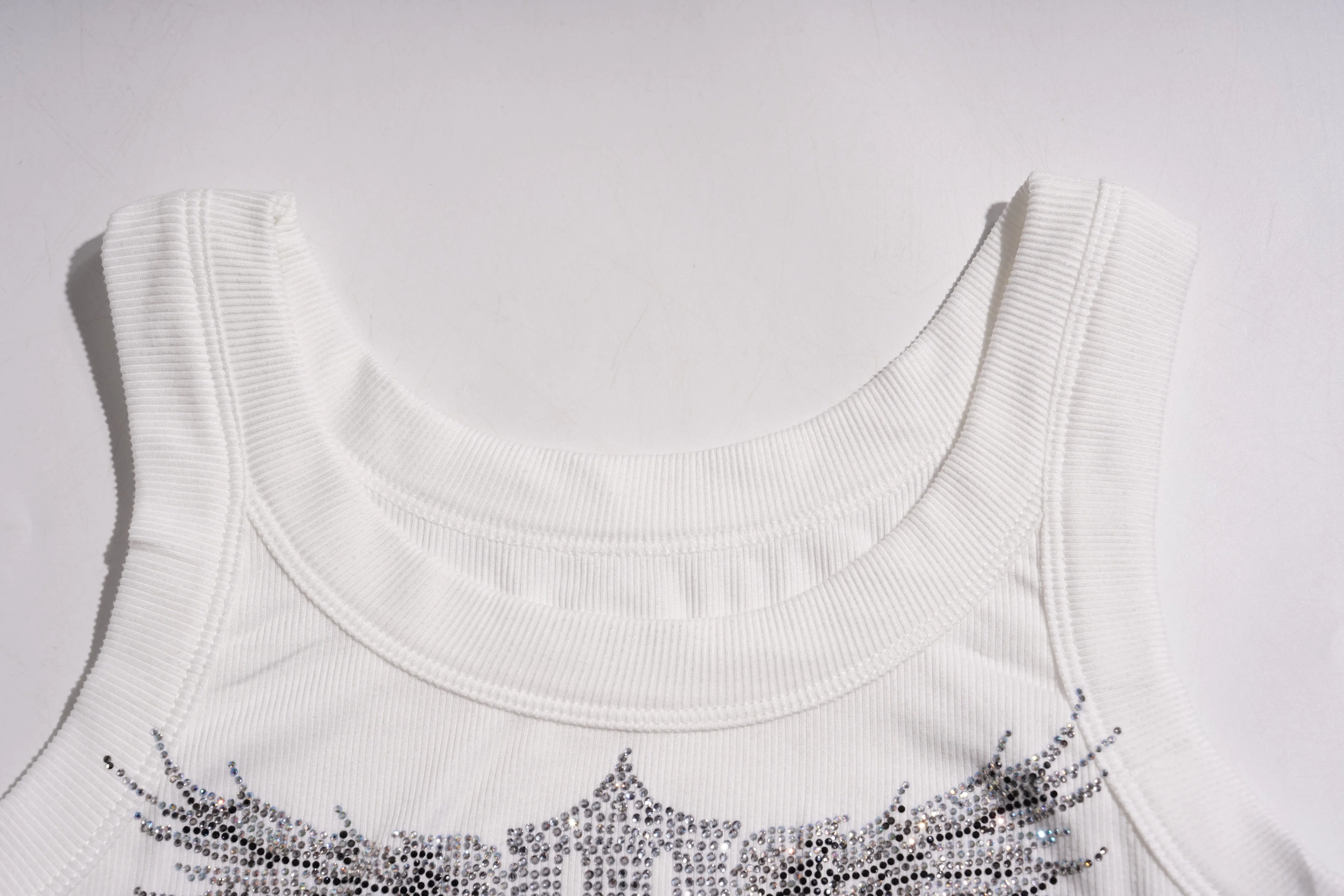 White sleeveless top with decorative embellishments on a light gray background, TCH Rhinestone Angel Wings Ribbed Tank Top
