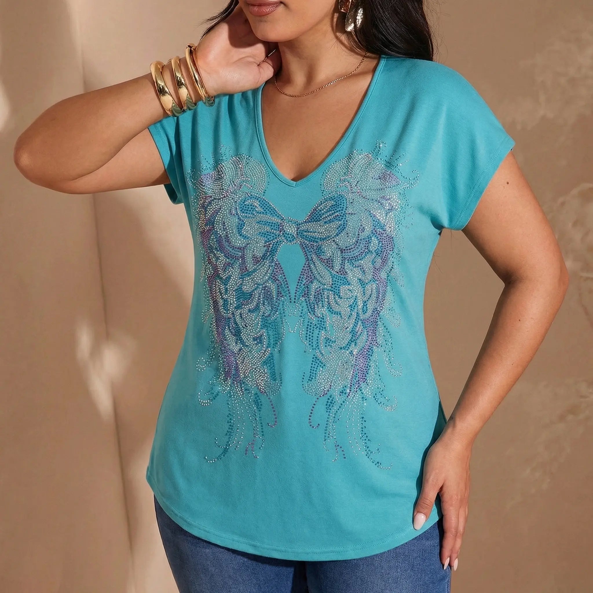 Woman wearing a turquoise t-shirt with decorative bow design on a beige background, TCH Rhinestone Angel Wings V-Neck T-Shirt