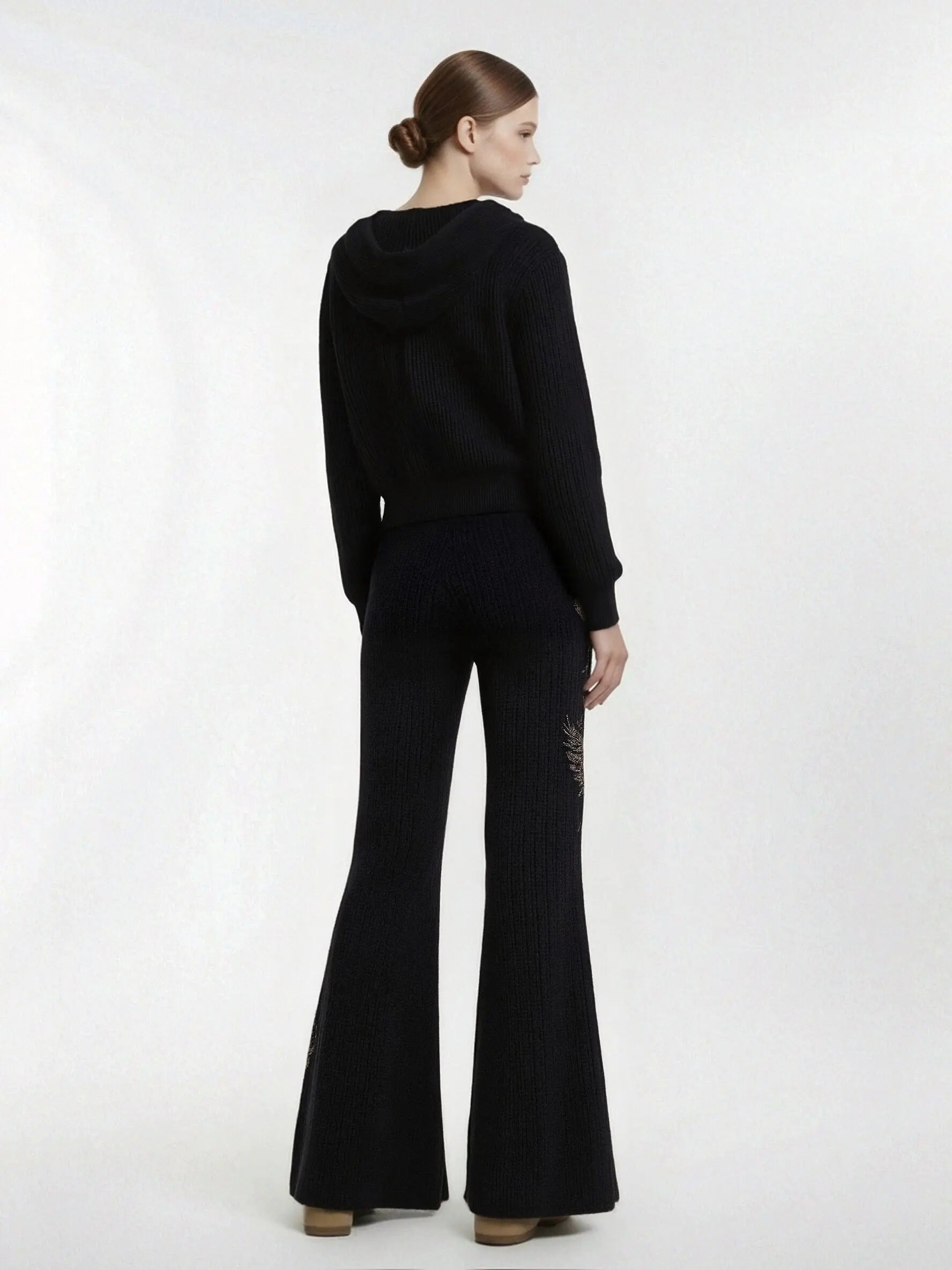 Person wearing a black outfit with flared pants on a white background, TCH Rhinestone Angel Wings Zip Hoodie & Flare Pants Set