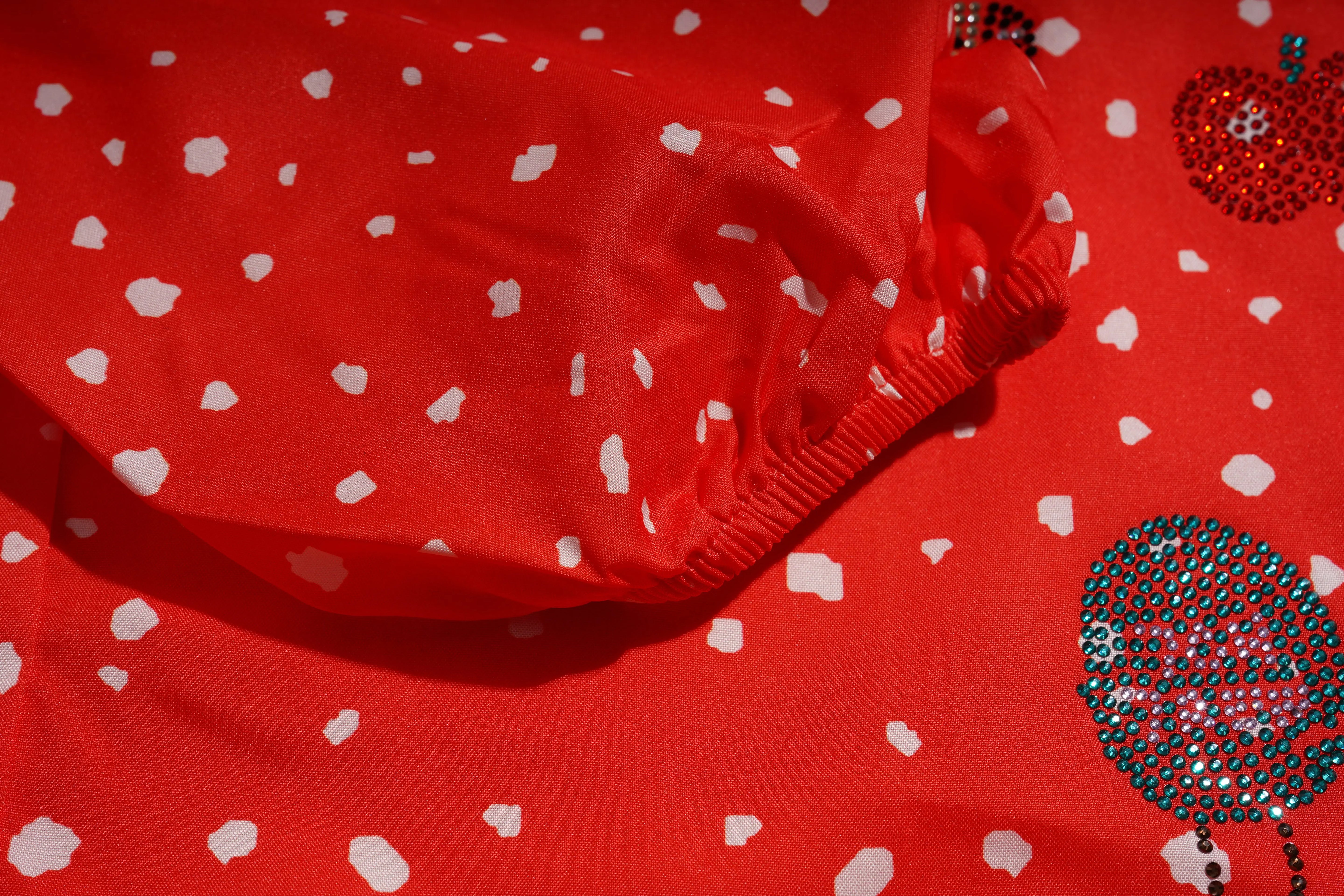Red garment with white heart patterns on a matching red background, TCH Rhinestone Animal Polka Dot Shirt