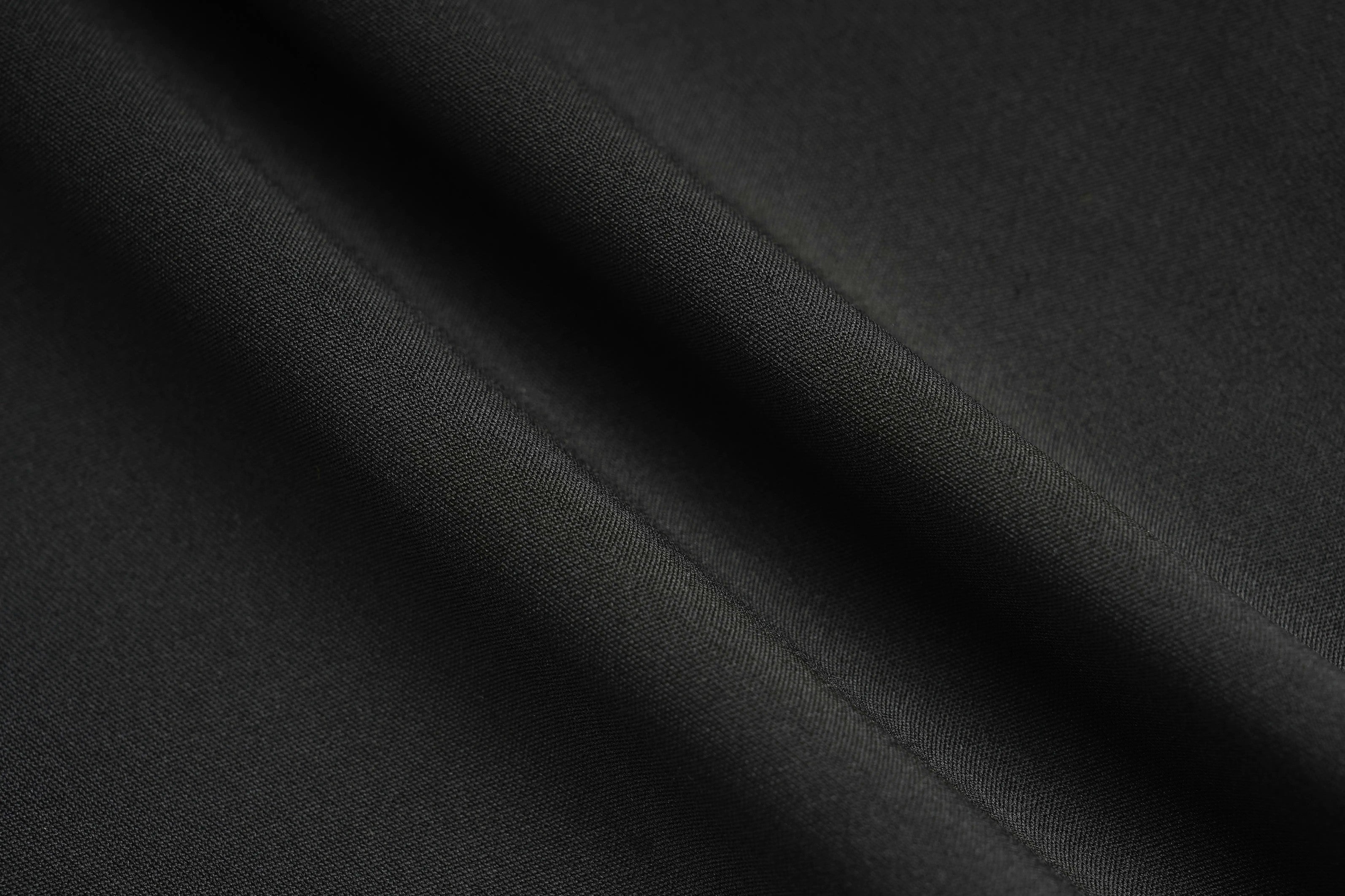 Close-up of black fabric with a subtle texture, TCH Rhinestone Blue Wings Black High-Waist Leggings