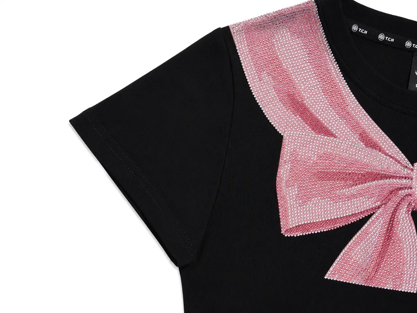 Close-up of a black short-sleeve T-shirt with a large pink sequined bow detail on the chest, shown against a white background. TCH Rhinestone Bow Collar Black Mini Dress