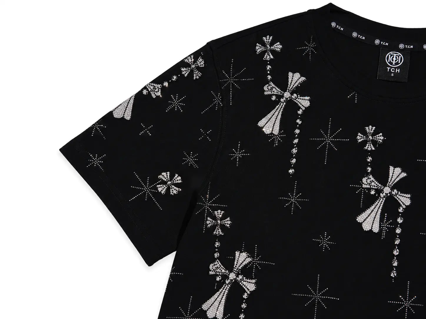 A black short-sleeve t-shirt featuring an all-over silver rhinestone pattern of crosses and starbursts, shown on a plain white background. TCH Rhinestone Bow Star Pattern Black T-Shirt