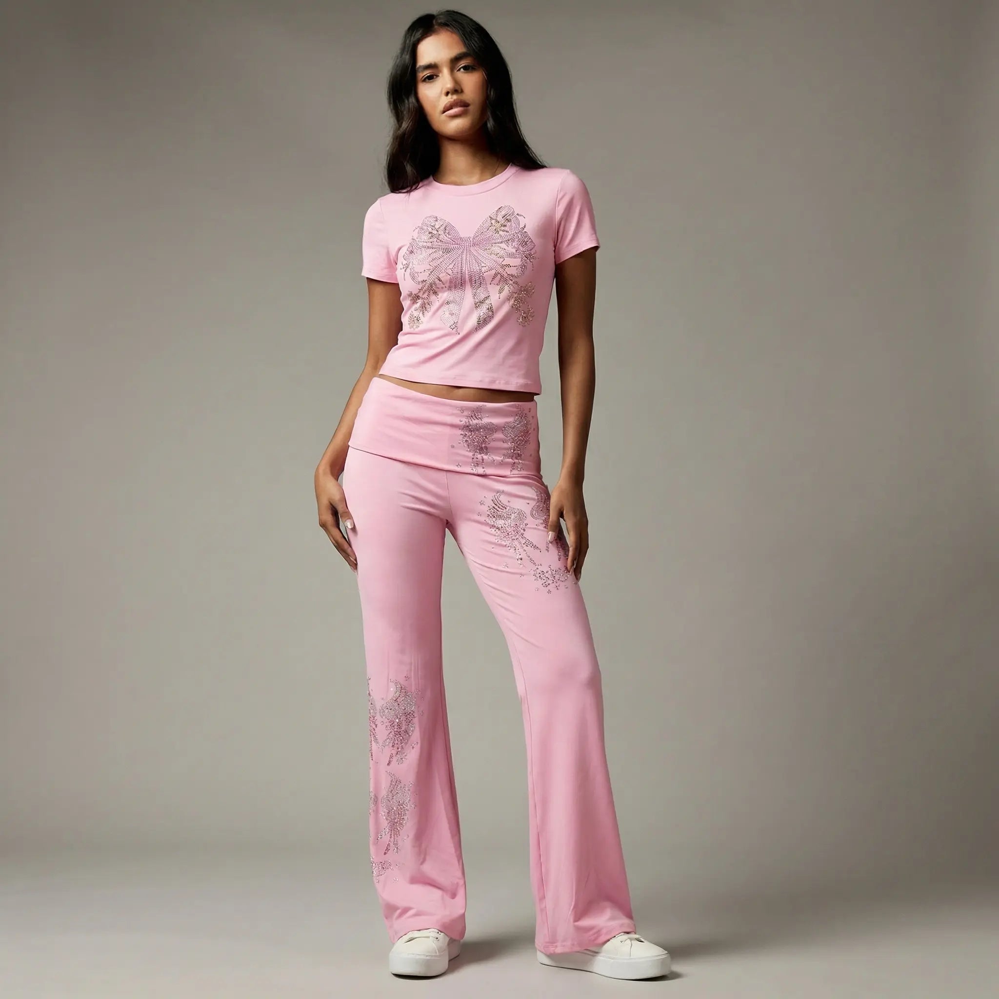Woman wearing a pink outfit with floral patterns on a plain background, TCH Rhinestone Bow & Wing Set