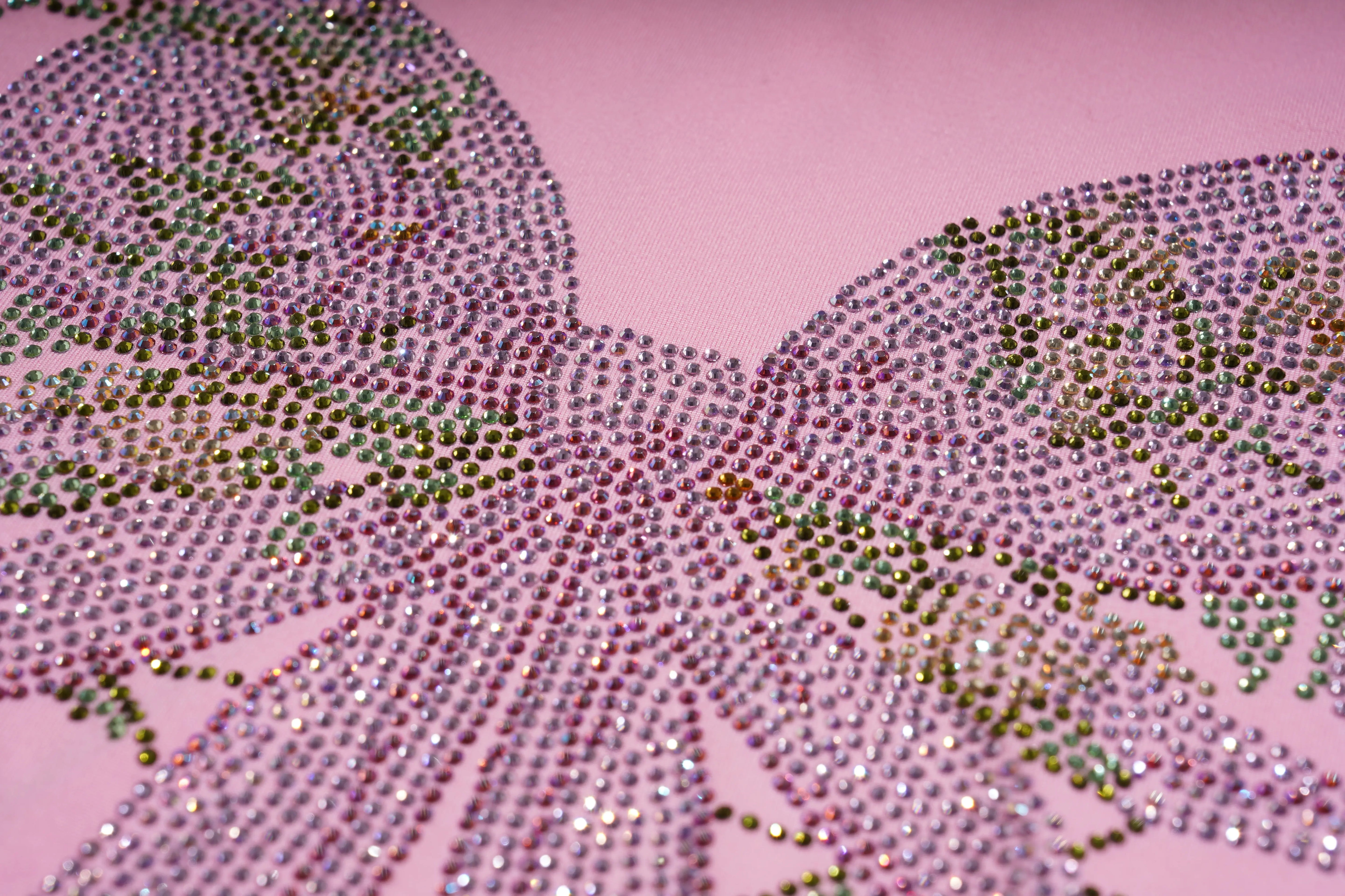 Close-up of a decorative butterfly design with rhinestones on a pink background, TCH Rhinestone Bow & Wing Set