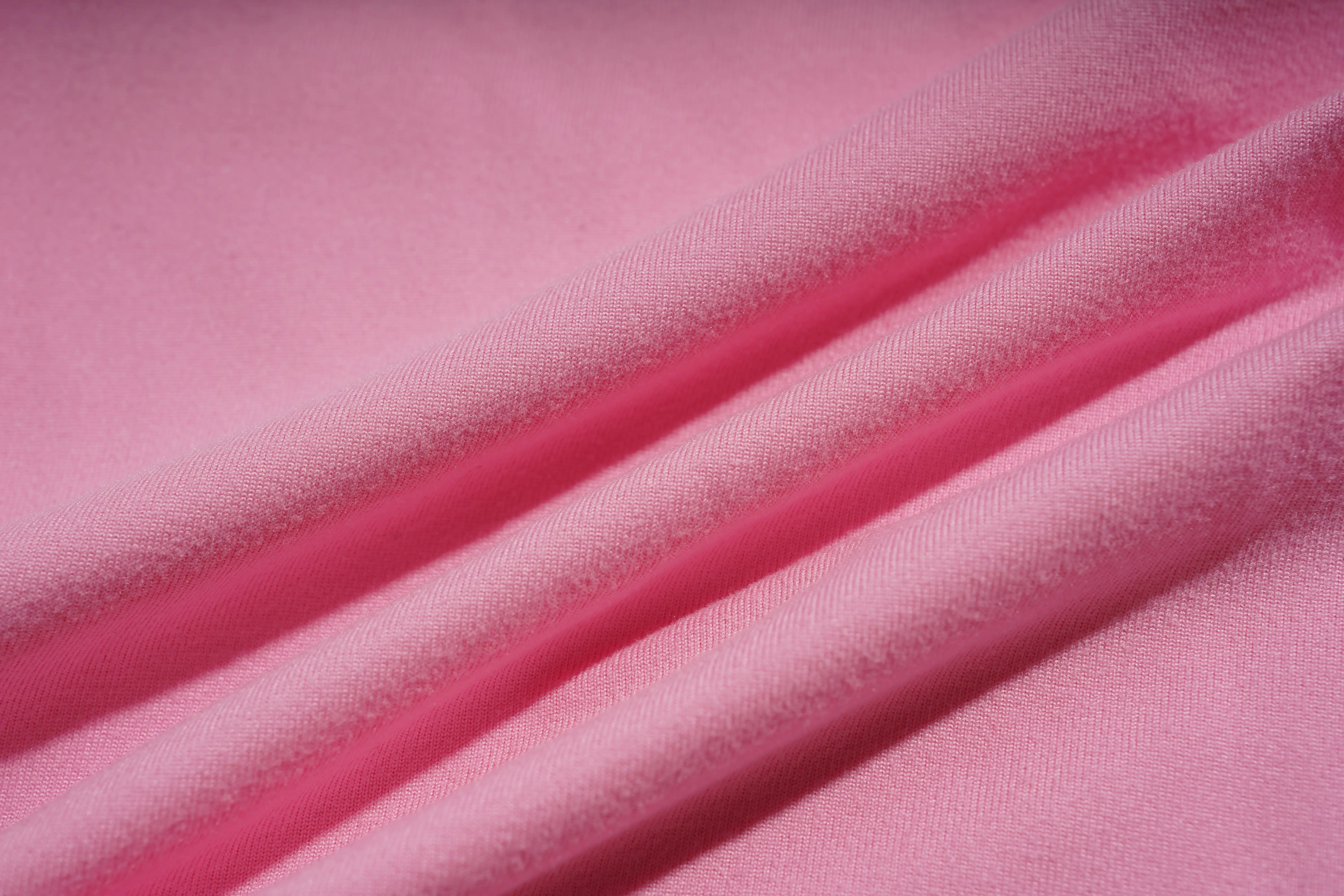 Close-up of pink fabric with visible texture, TCH Rhinestone Bow & Wing Set