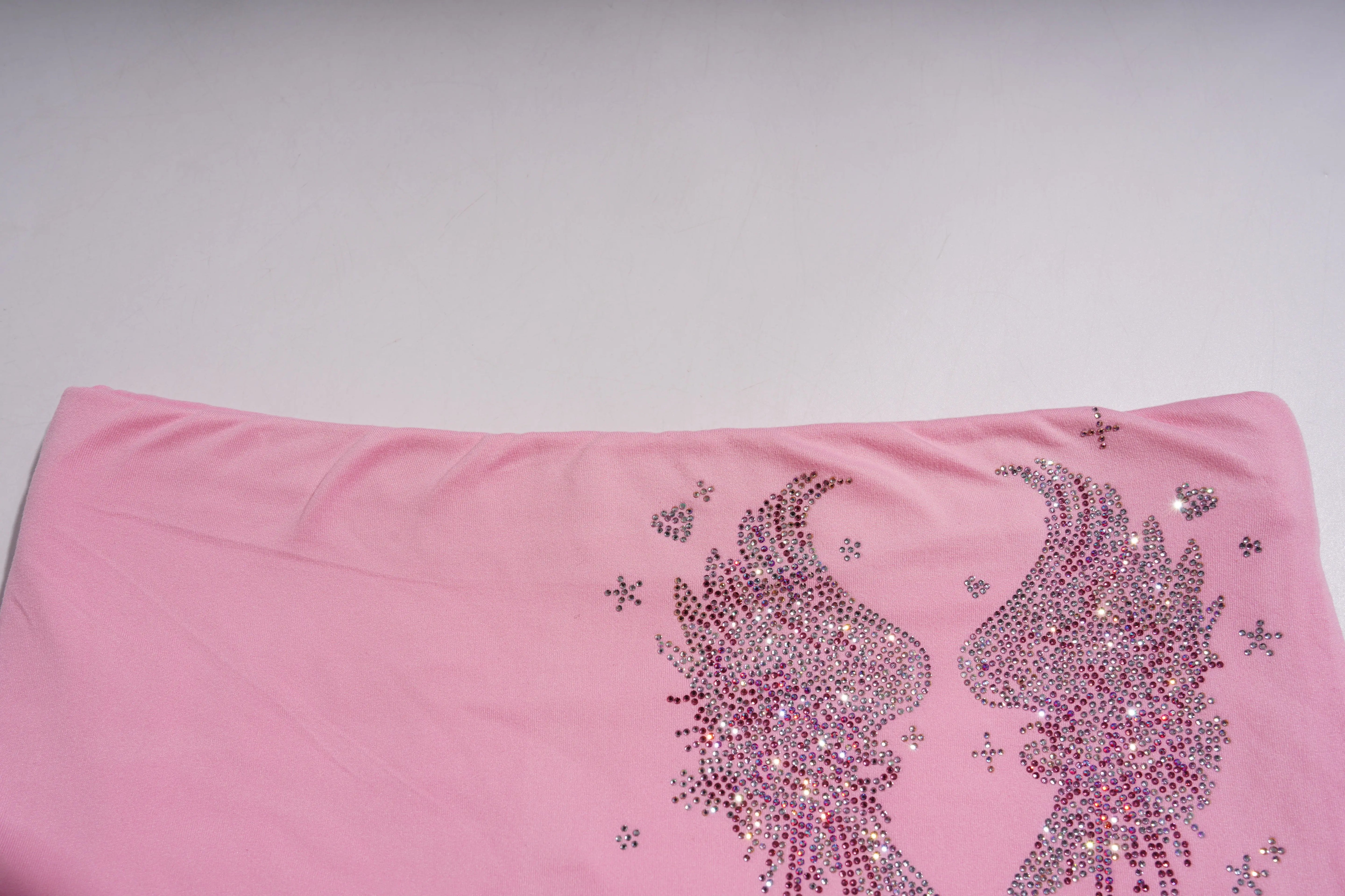 Pink fabric with rhinestone designs on a plain background, TCH Rhinestone Bow & Wing Set