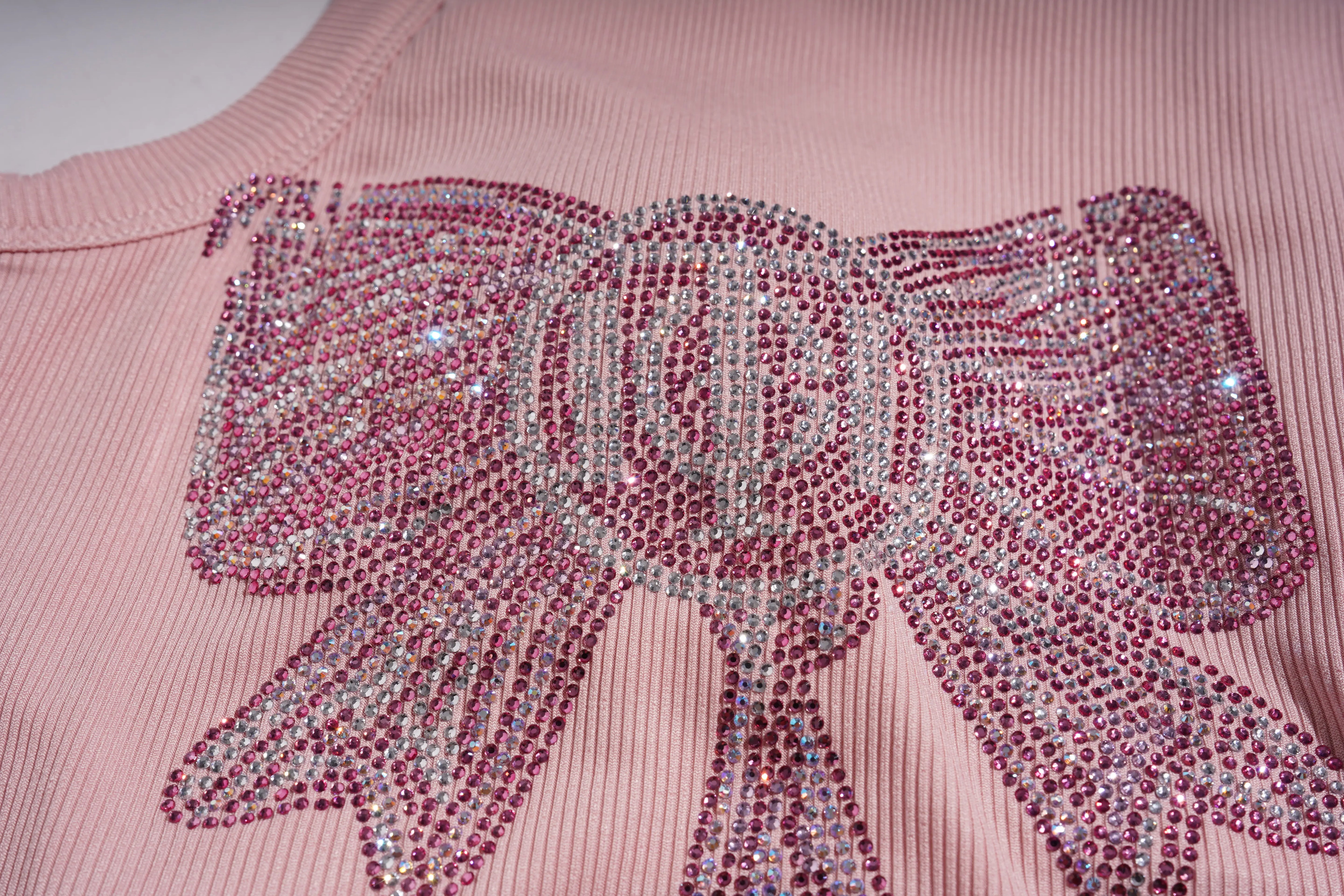 Pink sweater with a large, embellished bow design. TCH Rhinestone Butterfly Bow Tank Top