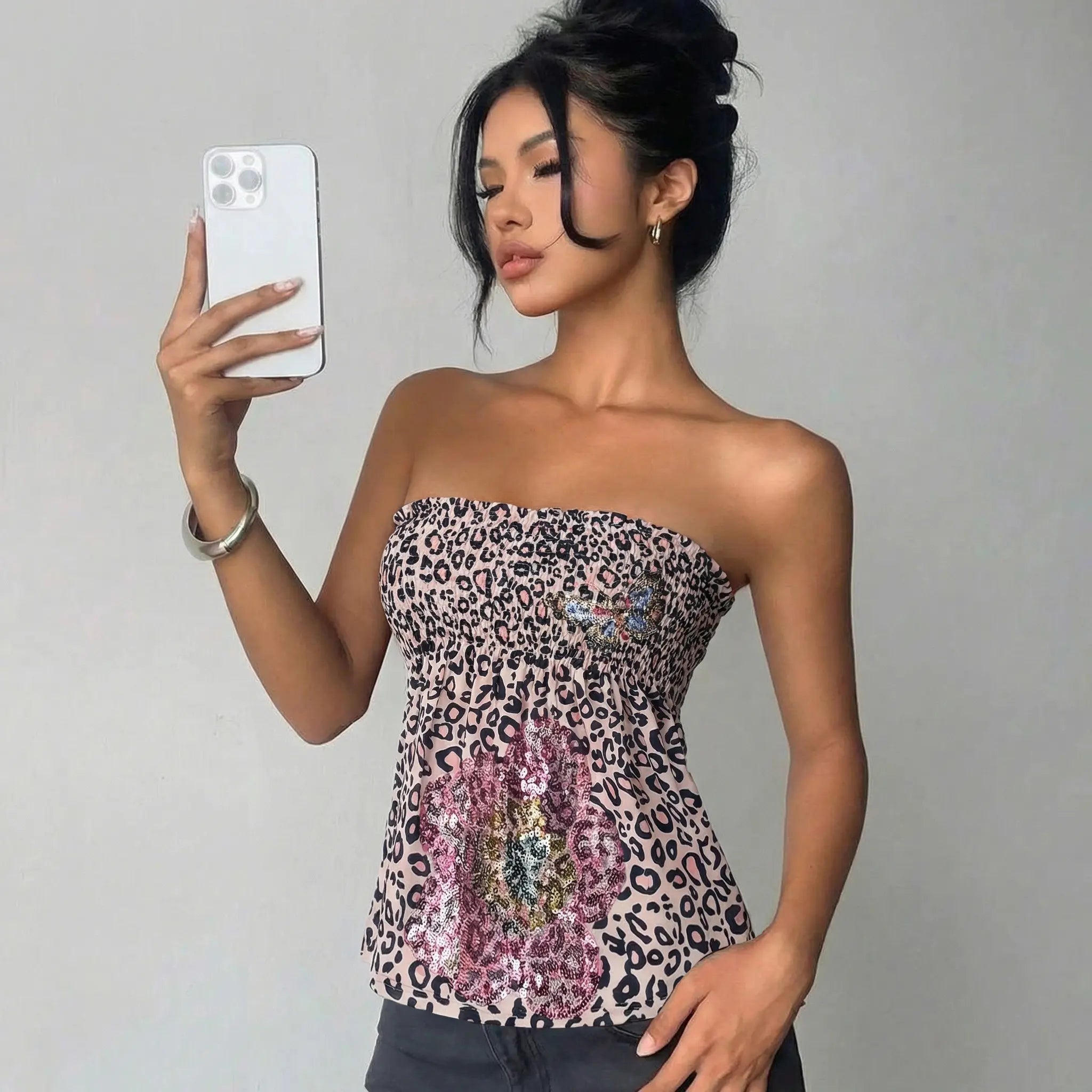 Woman wearing a strapless top with a leopard print pattern against a plain background, TCH Rhinestone Butterfly & Floral Leopard Tube Top