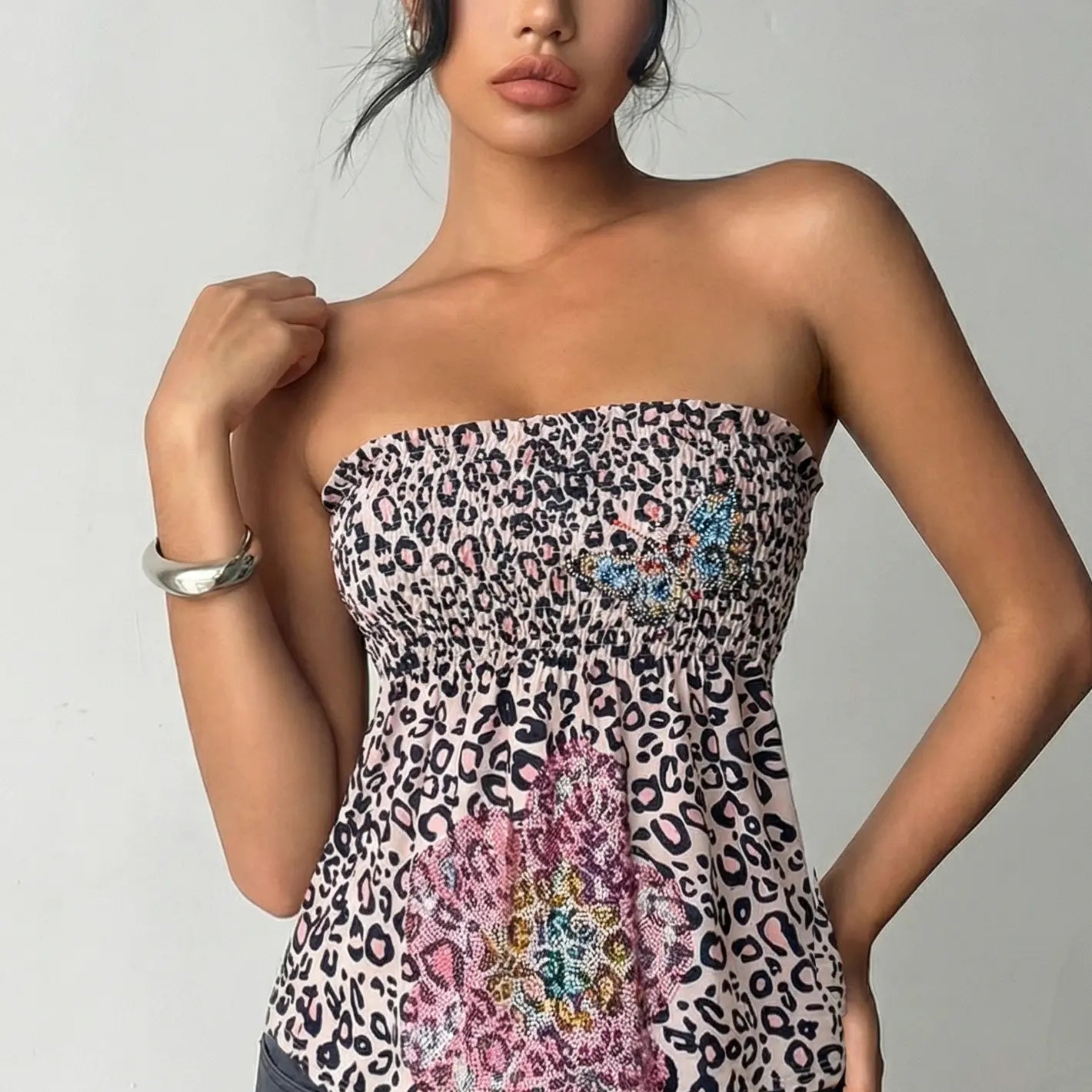 Woman wearing a strapless dress with leopard print and floral embroidery on a plain background, TCH Rhinestone Butterfly & Floral Leopard Tube Top