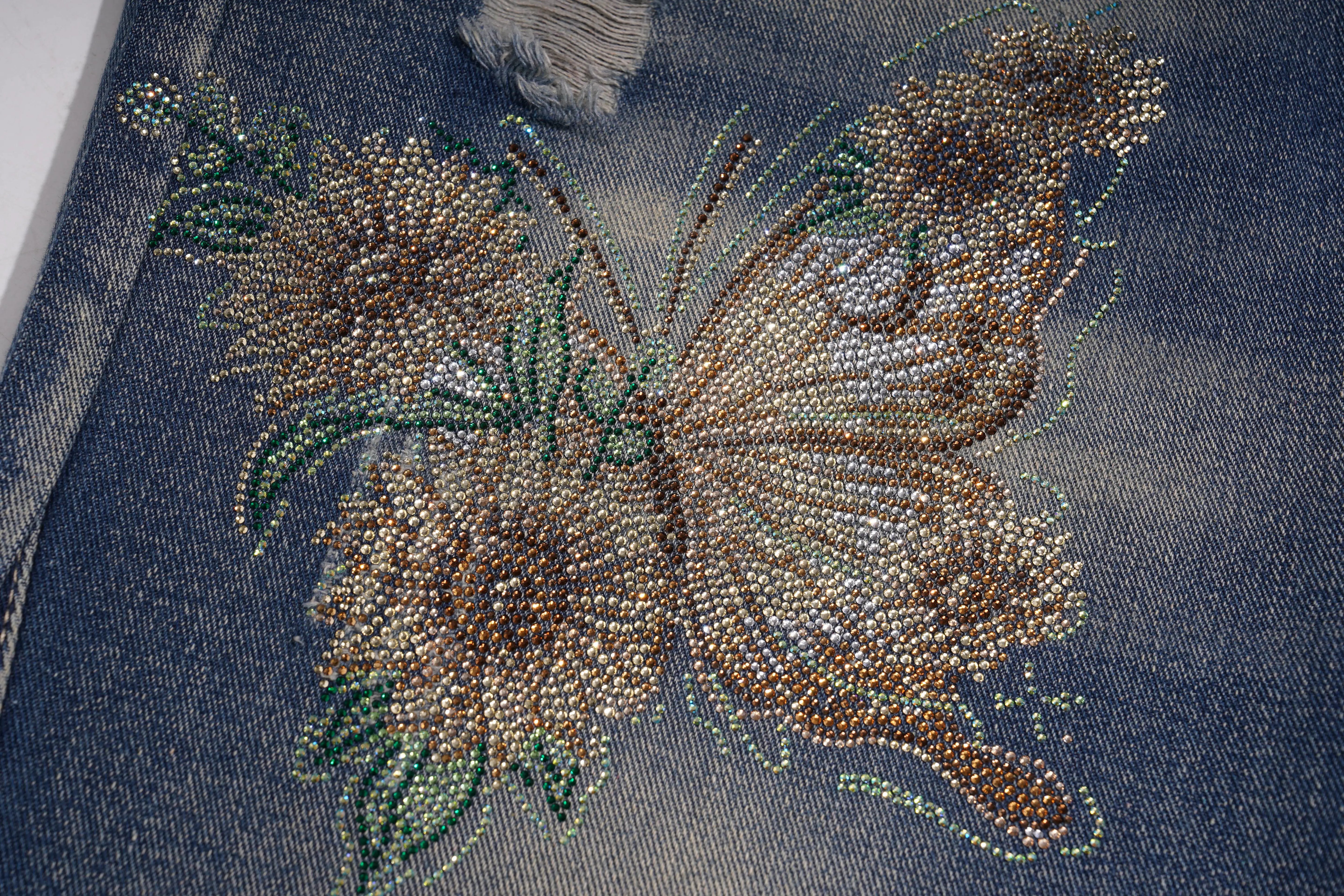 Butterfly design made of small stones on denim fabric, TCH Rhinestone Butterfly & Lily Distressed Denim Jeans