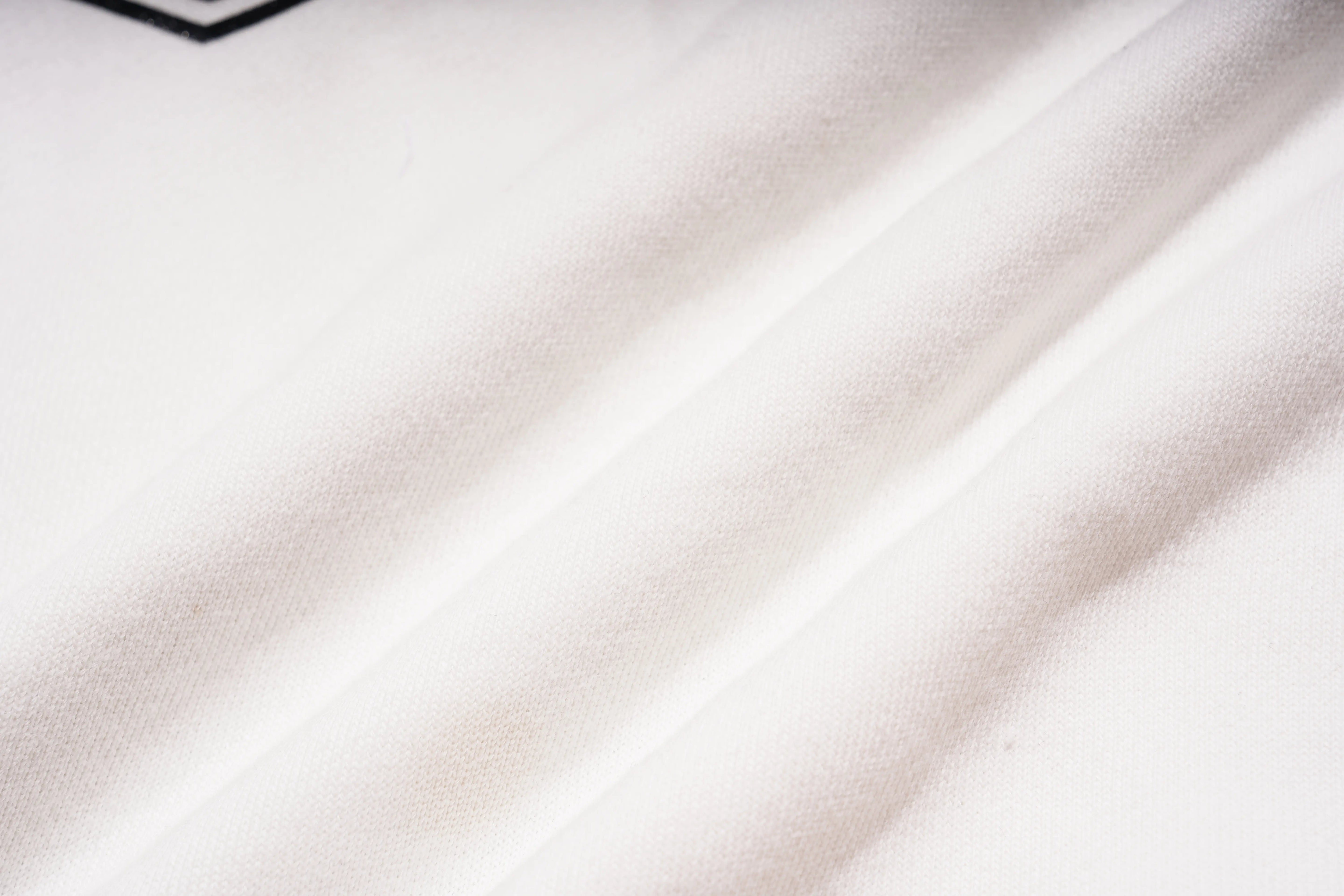 Close-up of white fabric with folds