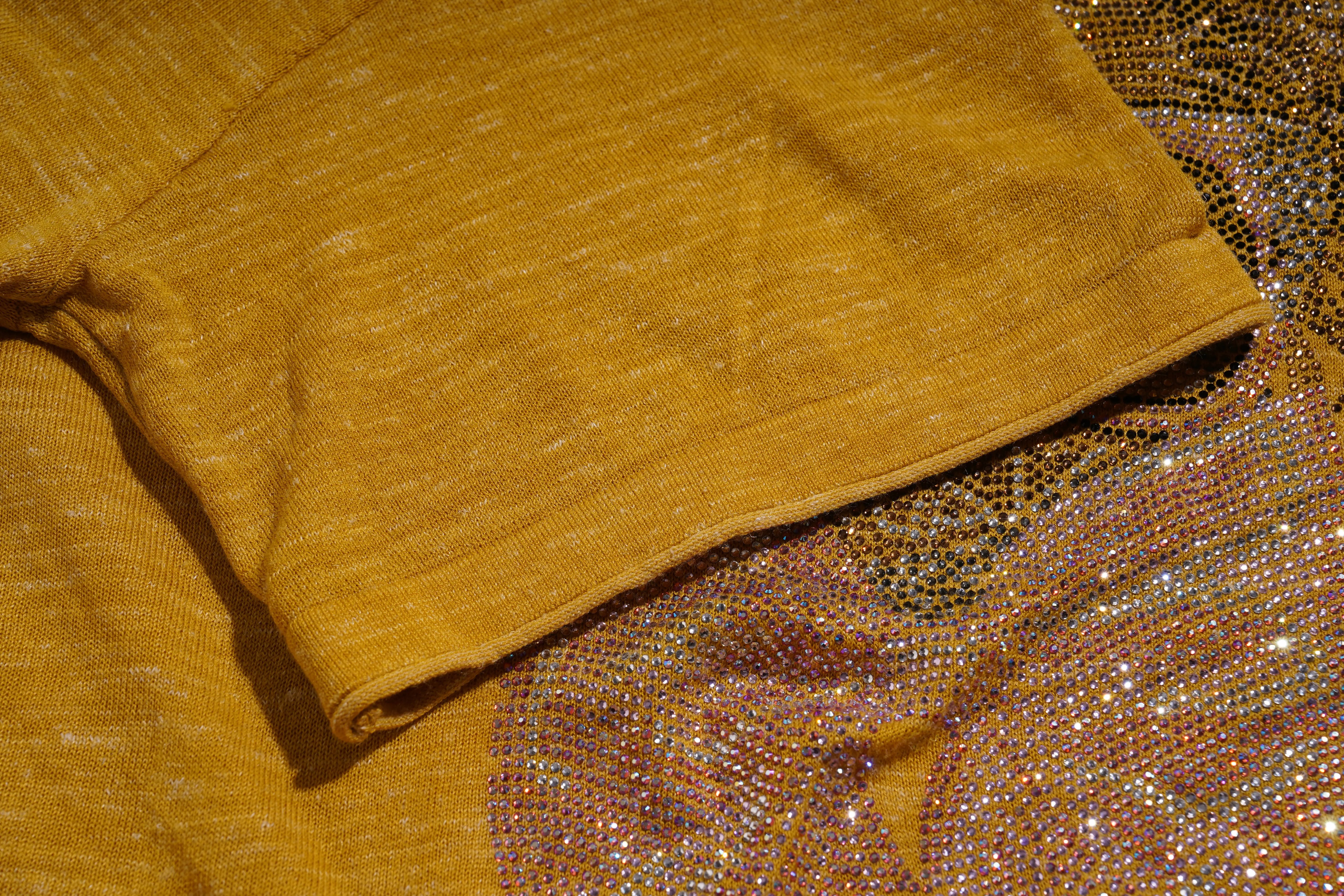 Mustard yellow fabric with a textured pattern on a glittery background. TCH Rhinestone Chihuahua Galaxy Set