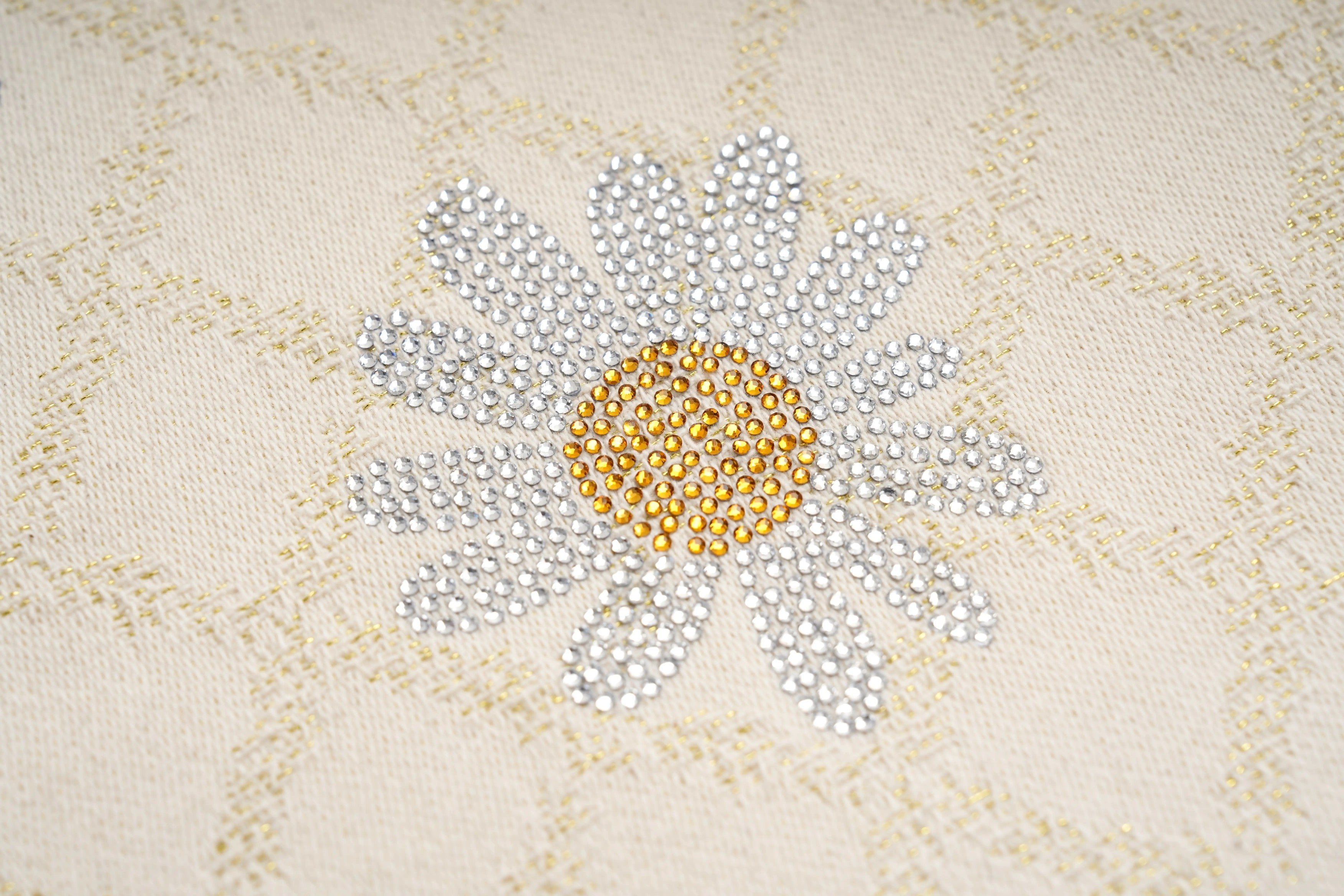 Decorative flower design with rhinestones on a textured fabric background, TCH Rhinestone Daisy Mesh Pattern Beige Denim Jeans