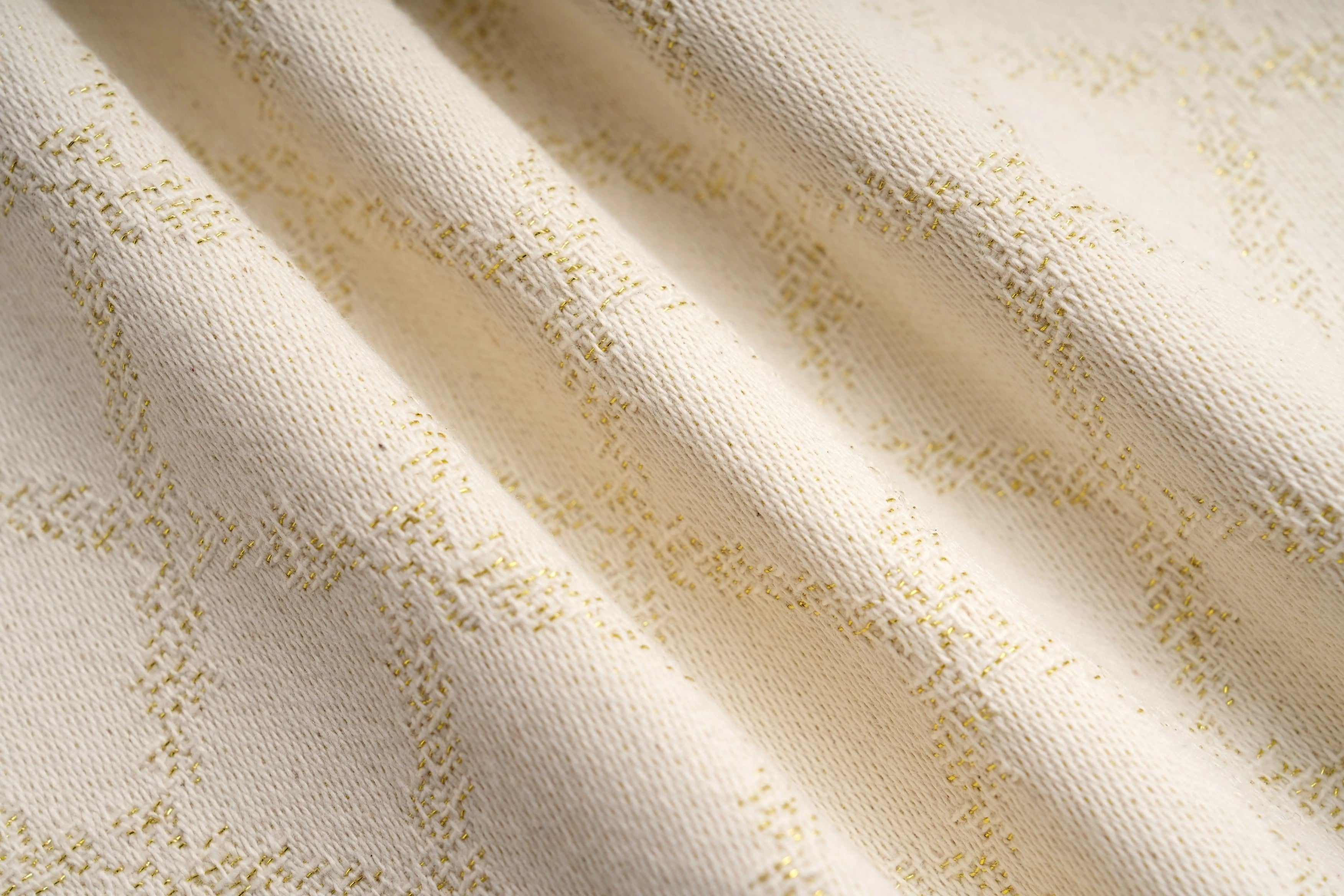 Close-up of beige fabric with subtle pattern, TCH Rhinestone Daisy Mesh Pattern Beige Denim Jeans