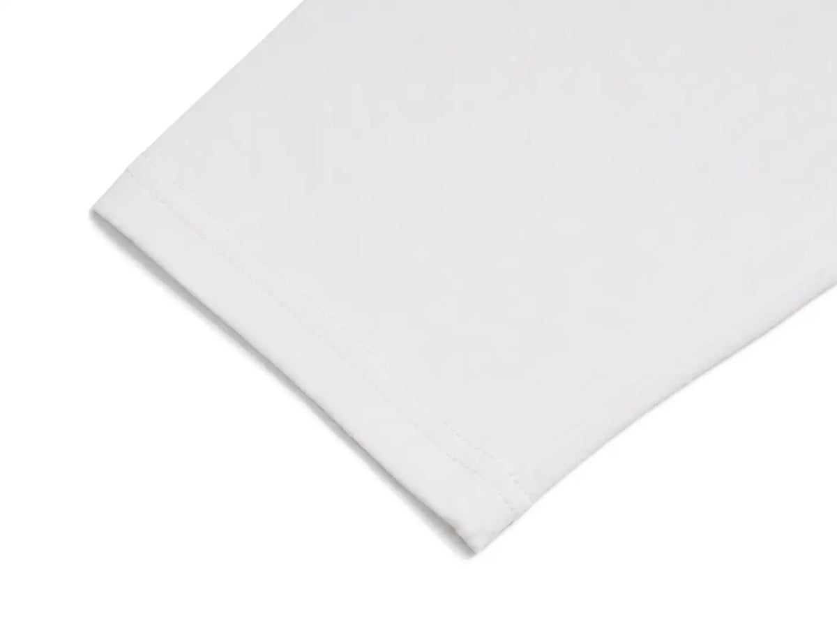 A close-up of a plain white folded fabric, showing a clean stitched hem on a white background. TCH Rhinestone Denim Corset Graphic Long Sleeve T-Shirt