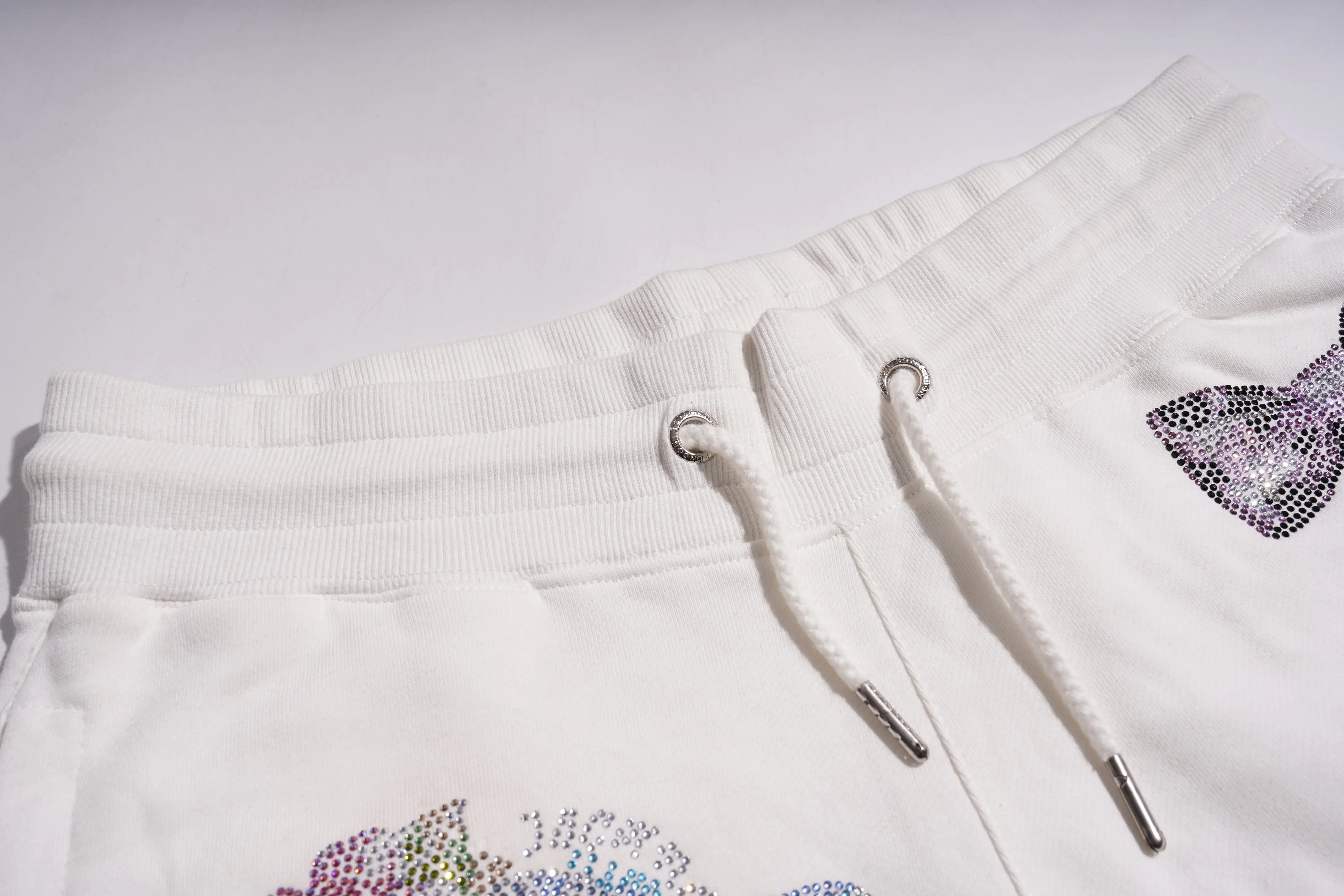 White hoodie with colorful rhinestone designs on a white background, TCH Rhinestone Elephant Bow White Casual Shorts Luxury Streetwear Brand Official Showcase