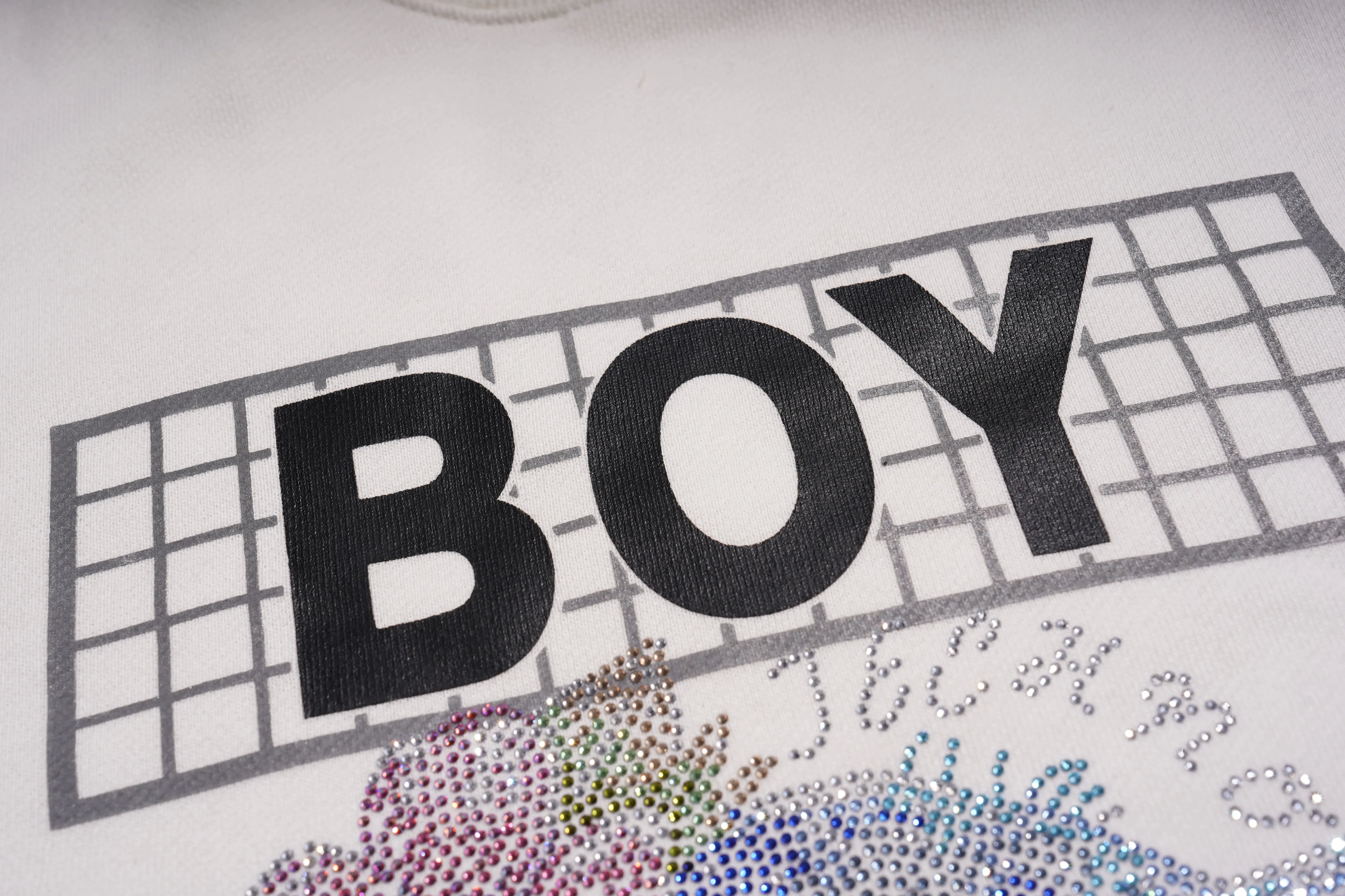 Text 'BOY' on a white background with decorative elements.