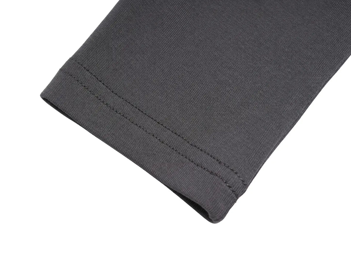 Close-up of a dark gray ribbed knit fabric cuff with neat double stitching, shown on a plain white background. TCH Rhinestone Fantasy Unicorn Graphic Long Sleeve T-Shirt