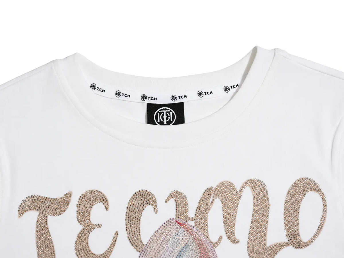 Close-up of a white short-sleeve T-shirt with large metallic rose-gold sequined lettering across the chest and a black neck label showing the brand. TCH Rhinestone Fantasy Unicorn Graphic Long Sleeve T-Shirt