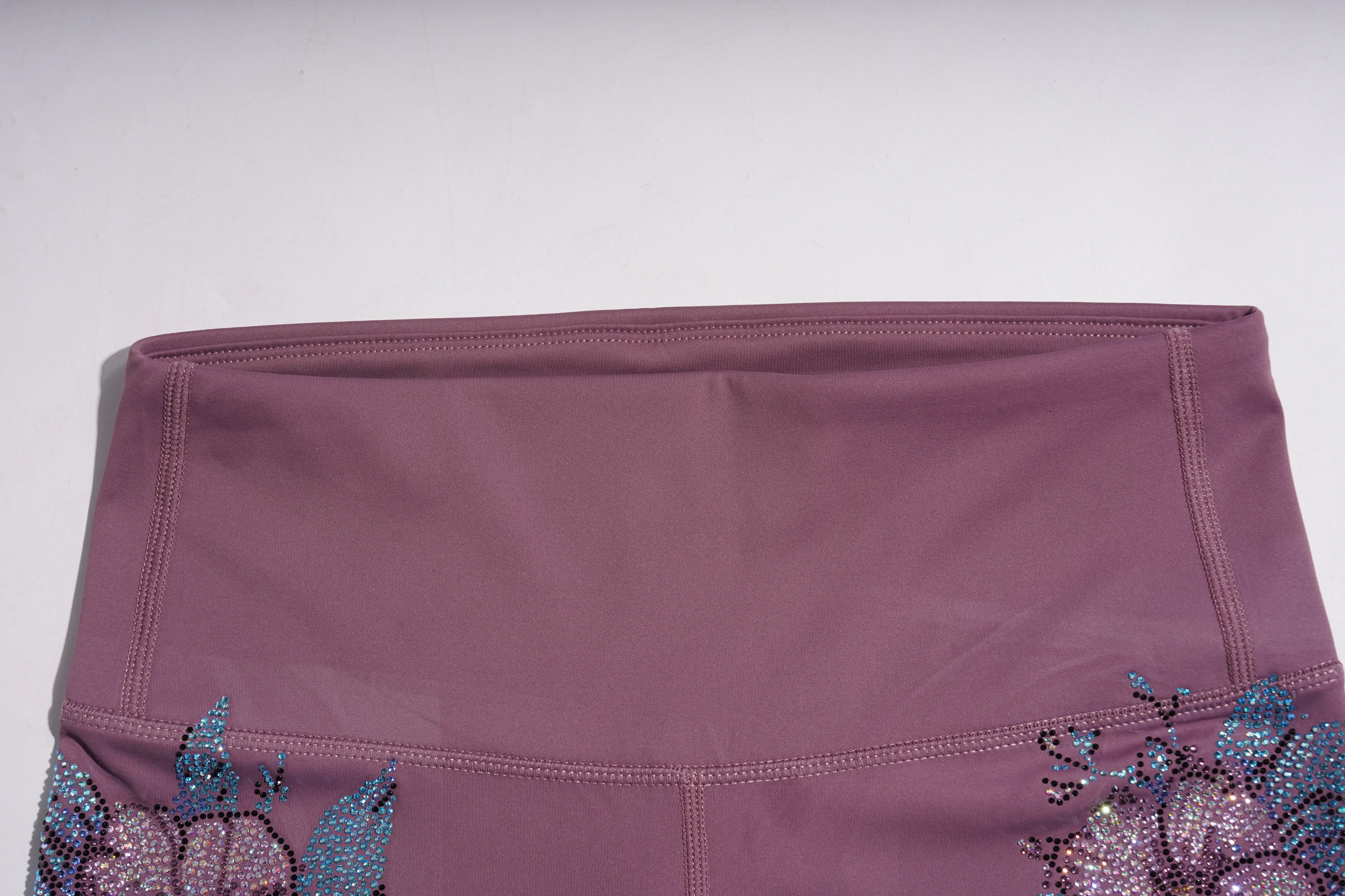 Purple fabric with decorative elements on a plain background, TCH Rhinestone Floral Wing High-Waist Leggings
